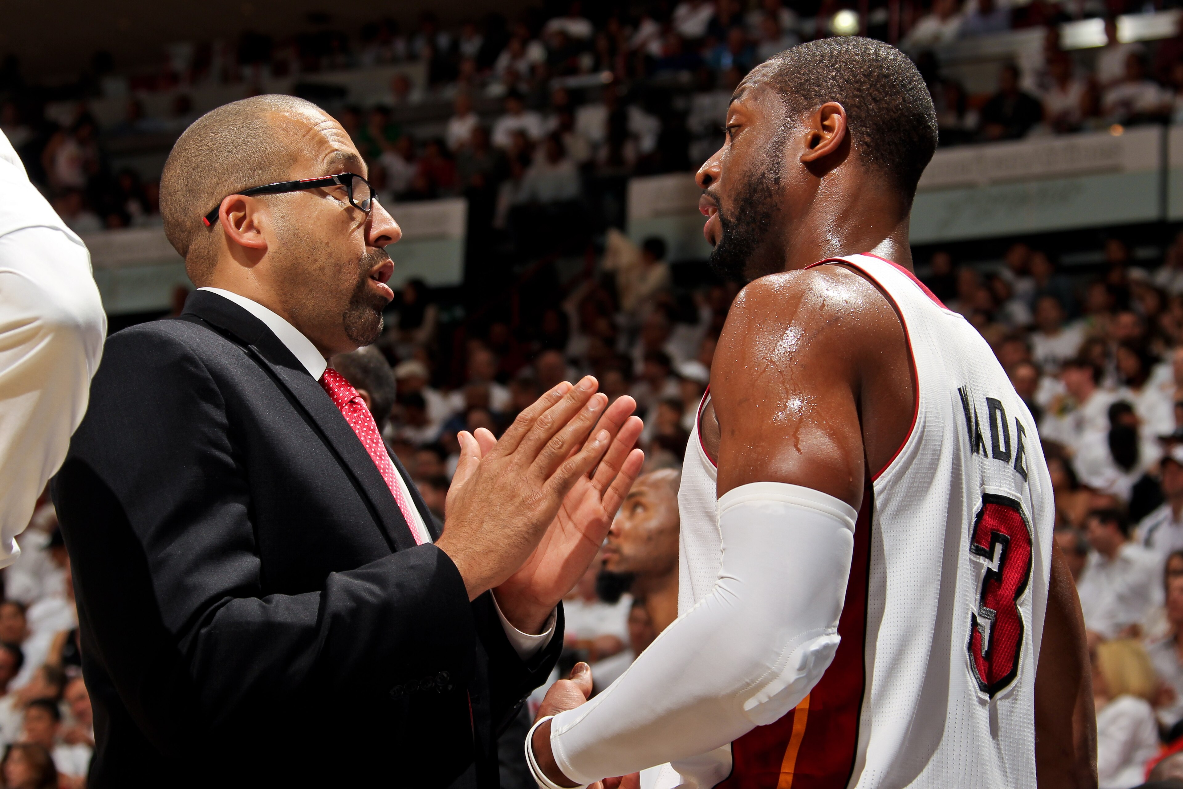 MIAMI, FL - MAY 8: David Fizdale, assistant coach of the Miami Heat, speaks with Dwyane Wade #3 as the team plays the Chicago Bulls in Game Two of the Eastern Conference Semifinals during the 2013 NBA Playoffs on May 8, 2013 at American Airlines Arena in 