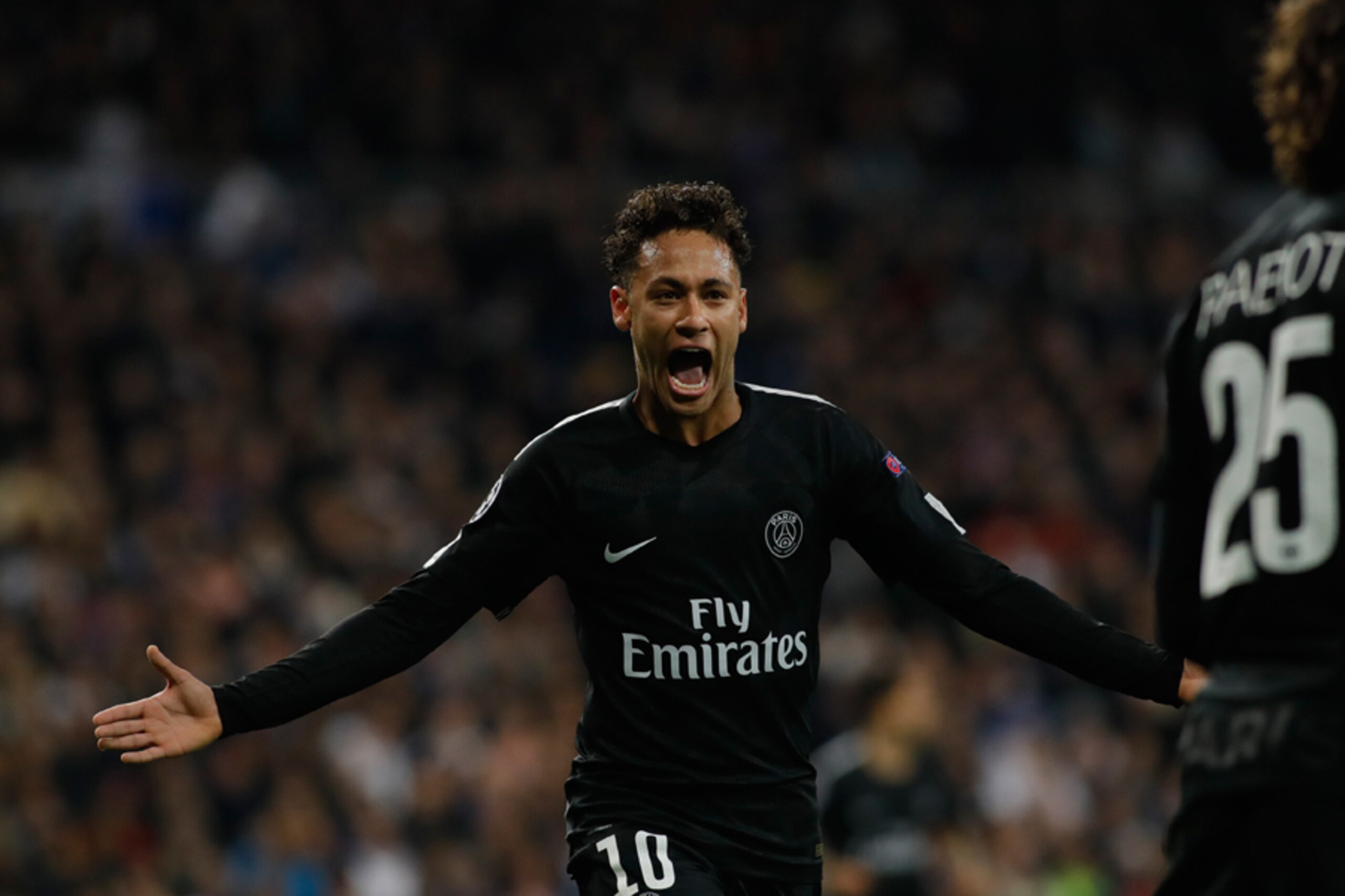 MADRID, SPAIN - FEBRUARY 14: Adrien Rabiot of Paris celebrates after scoring his team`s first goal with team mate Neymar of Paris during the UEFA Champions League Round of 16 First Leg match between Real Madrid and Paris Saint-Germain at Bernabeu on Febru
