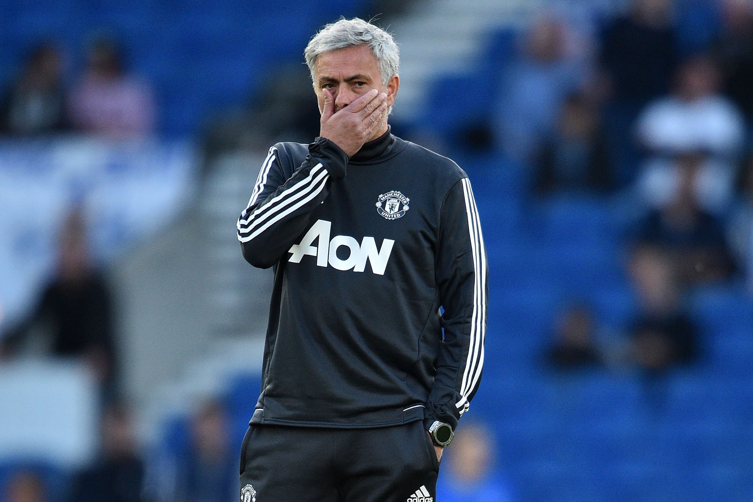 Manchester United's Portuguese manager Jose Mourinho gestures as he watches his players warm up ahead of the English Premier League football match between Brighton and Hove Albion and Manchester United at the American Express Community Stadium in Brighton