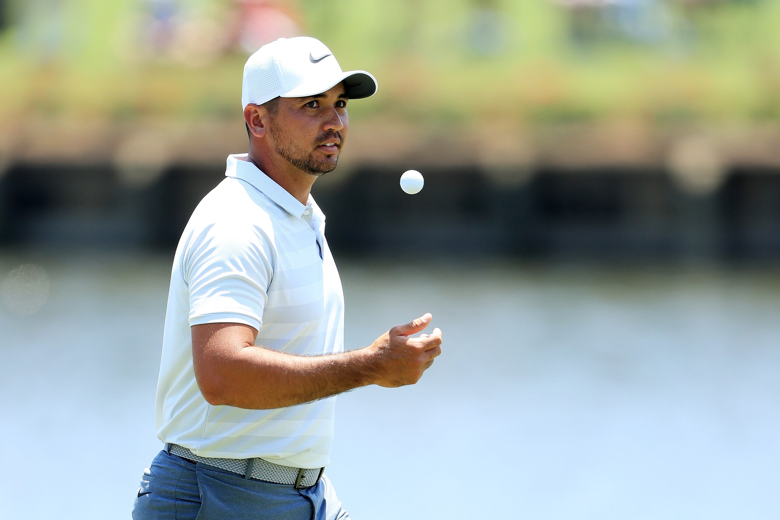 PONTE VEDRA BEACH, FL - MAY 09:  Jason Day of Australia tosses a ball during practice rounds prior to THE PLAYERS Championship on the Stadium Course at TPC Sawgrass on May 9, 2018 in Ponte Vedra Beach, Florida.  (Photo by Sam Greenwood/Getty Images)
