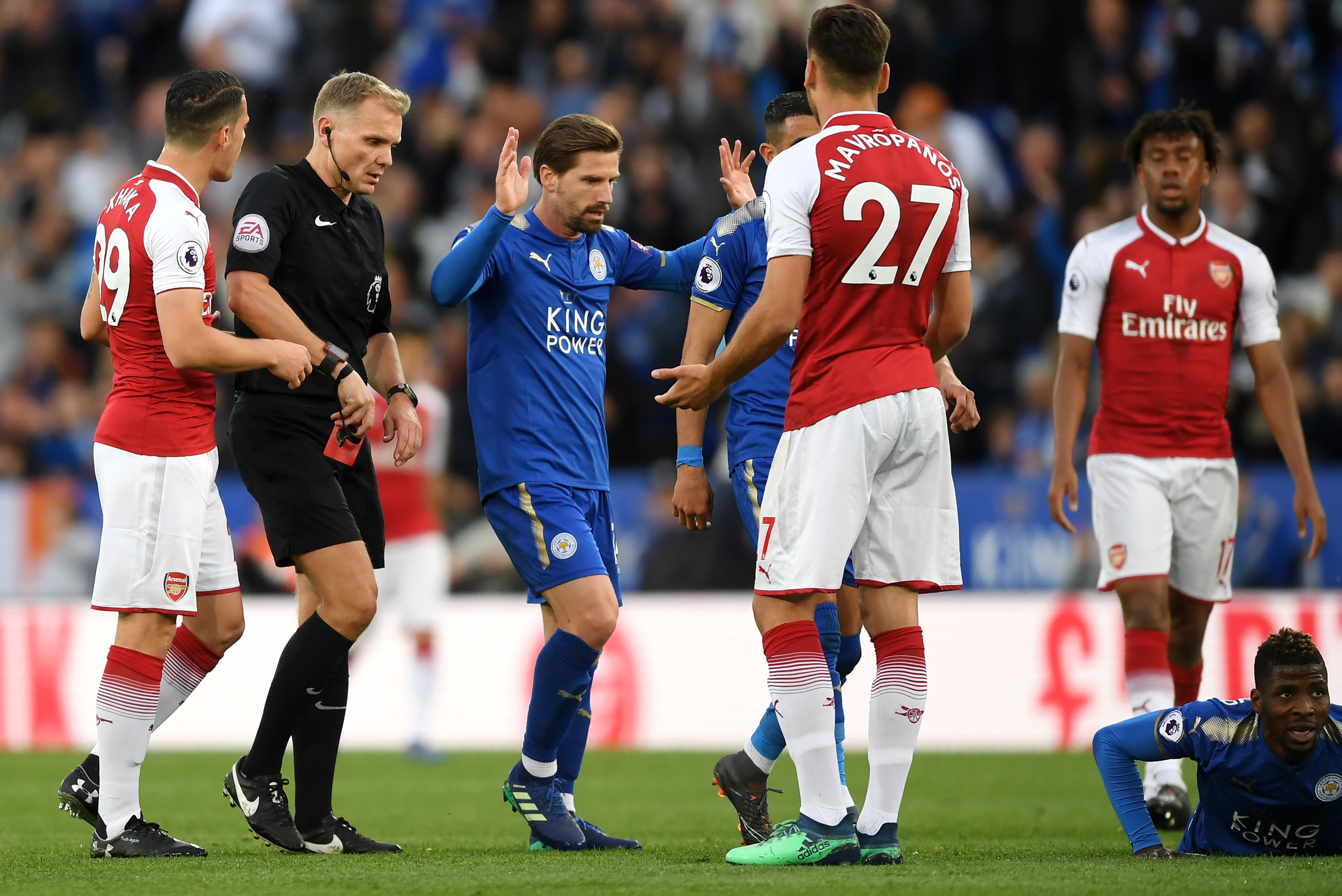 LEICESTER, ENGLAND - MAY 09:  Konstantinos Mavropanos of Arsenal is shown a red card by referee Graham Scott during the Premier League match between Leicester City and Arsenal at The King Power Stadium on May 9, 2018 in Leicester, England.  (Photo by Shau