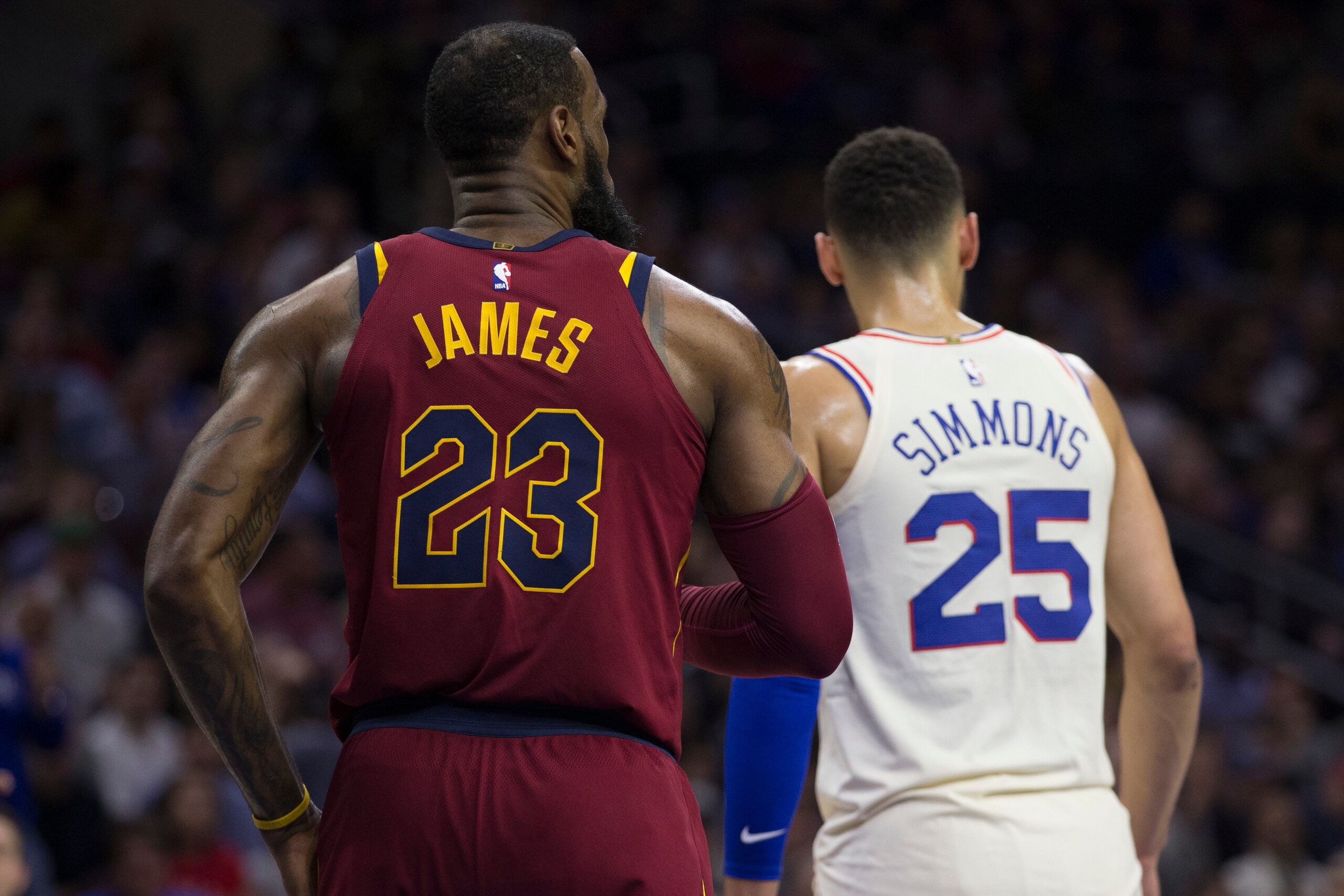 PHILADELPHIA, PA - APRIL 6: LeBron James #23 of the Cleveland Cavaliers and Ben Simmons #25 of the Philadelphia 76ers look on at the Wells Fargo Center on April 6, 2018 in Philadelphia, Pennsylvania. NOTE TO USER: User expressly acknowledges and agrees th PHILADELPHIA, PA - APRIL 6: LeBron James #23 of the Cleveland Cavaliers and Ben Simmons #25 of the Philadelphia 76ers look on at the Wells Fargo Center on April 6, 2018 in Philadelphia, Pennsylvania. NOTE TO USER: User expressly acknowledges and agrees th