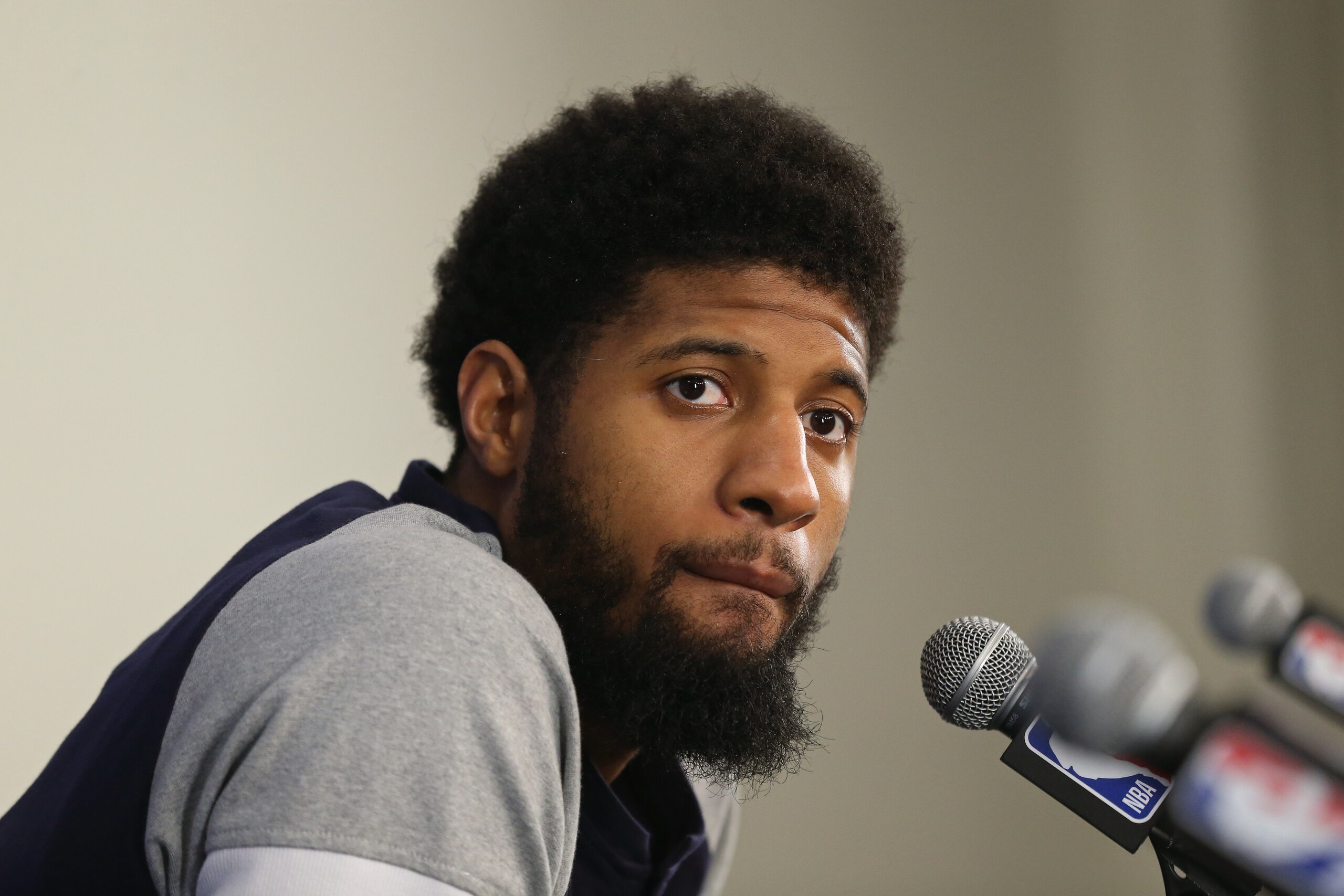 OKLAHOMA CITY, OK - APRIL 25: Paul George #13 of the Oklahoma City Thunder speaks with the media during a press conference after the game against the Utah Jazz in Game Five of Round One of the 2018 NBA Playoffs on April 25, 2018 at Chesapeake Energy Aren OKLAHOMA CITY, OK - APRIL 25: Paul George #13 of the Oklahoma City Thunder speaks with the media during a press conference after the game against the Utah Jazz in Game Five of Round One of the 2018 NBA Playoffs on April 25, 2018 at Chesapeake Energy Aren