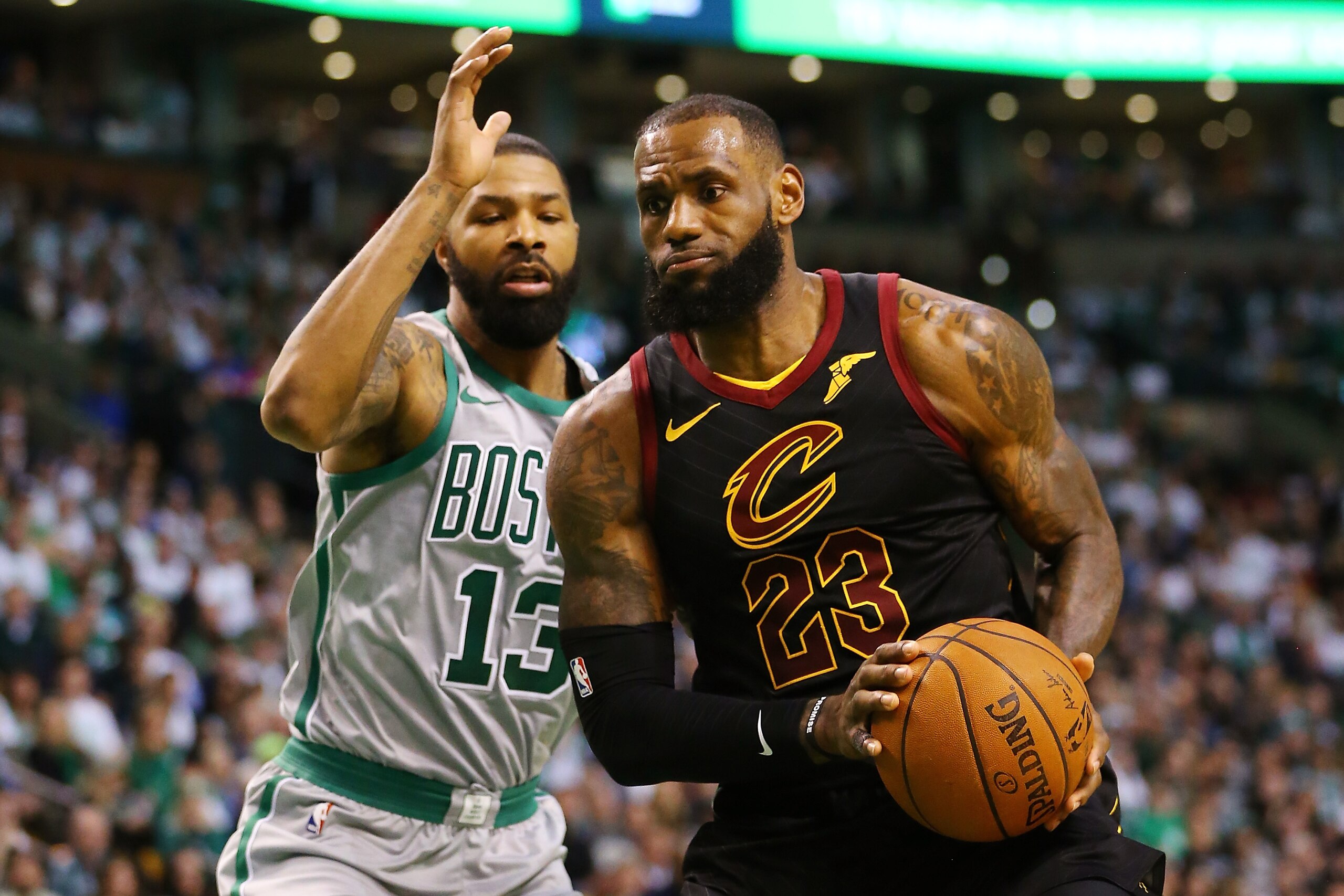 BOSTON, MA - FEBRUARY 11:  Lebron James #23 of the Cleveland Cavaliers drives to the basket past Marcus Morris #13 of the Boston Celtics during the first quarter of a game at TD Garden on February 11, 2018 in Boston, Massachusetts. NOTE TO USER: User expr