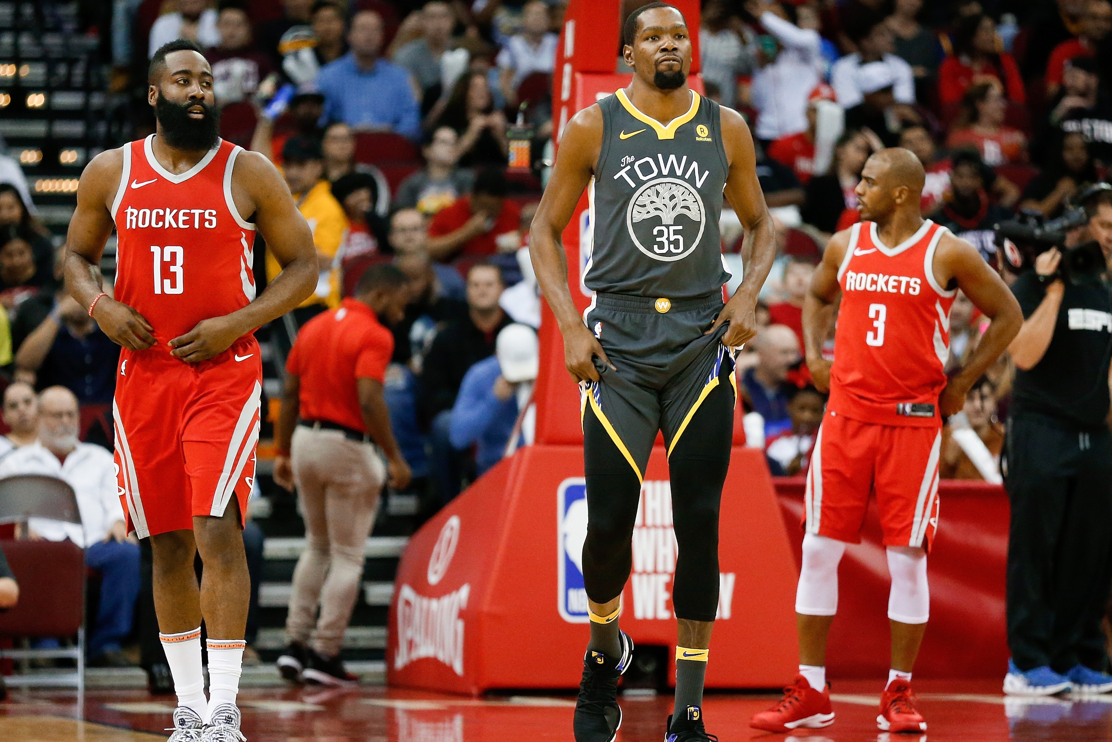 HOUSTON, TX - JANUARY 20:   James Harden #13 of the Houston Rockets, Kevin Durant #35 of the Golden State Warriors and Chris Paul #3 of the Houston Rockets at Toyota Center on January 20, 2018 in Houston, Texas. NOTE TO USER: User expressly acknowledges a