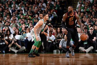 BOSTON, MA - FEBRUARY 11: LeBron James #23 of the Cleveland Cavaliers handles the ball during the game against Jayson Tatum #0 of the Boston Celtics during the game between the two teams on February 11, 2018 at the TD Garden in Boston, Massachusetts.  NOT