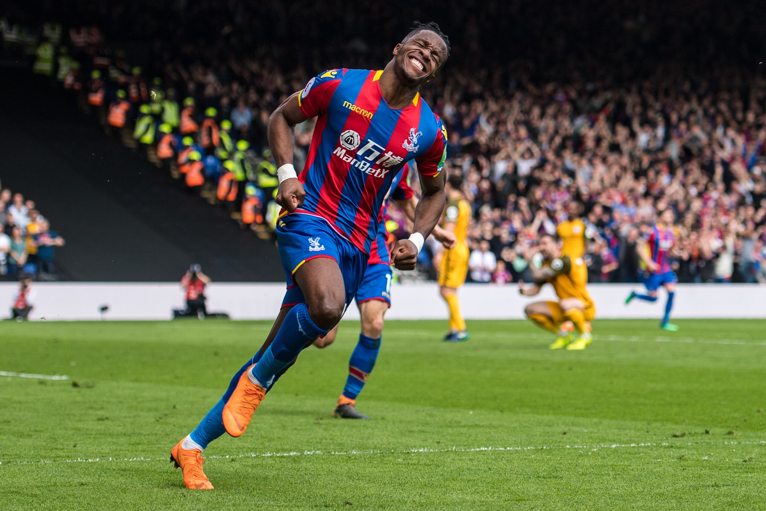LONDON, ENGLAND - APRIL 14:  Wilfried Zaha (11) of Crystal Palace celebrates after scoring he's 2nd goal in the Premier League match between Crystal Palace and Brighton and Hove Albion at Selhurst Park on April 14, 2018 in London, England. (Photo by MB Me