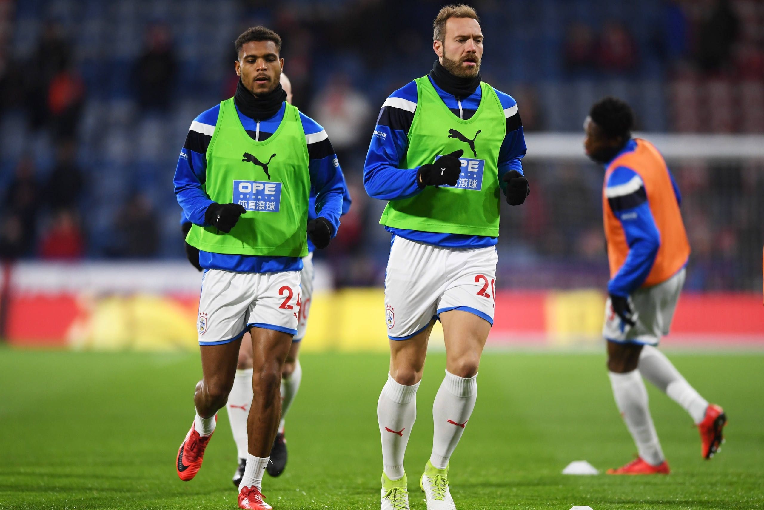 HUDDERSFIELD, ENGLAND - JANUARY 30:  Laurent Depoitre (20) and Steve Mounie of Huddersfield Town (24) warms up prior to the Premier League match between Huddersfield Town and Liverpool at John Smith's Stadium on January 30, 2018 in Huddersfield, England. 