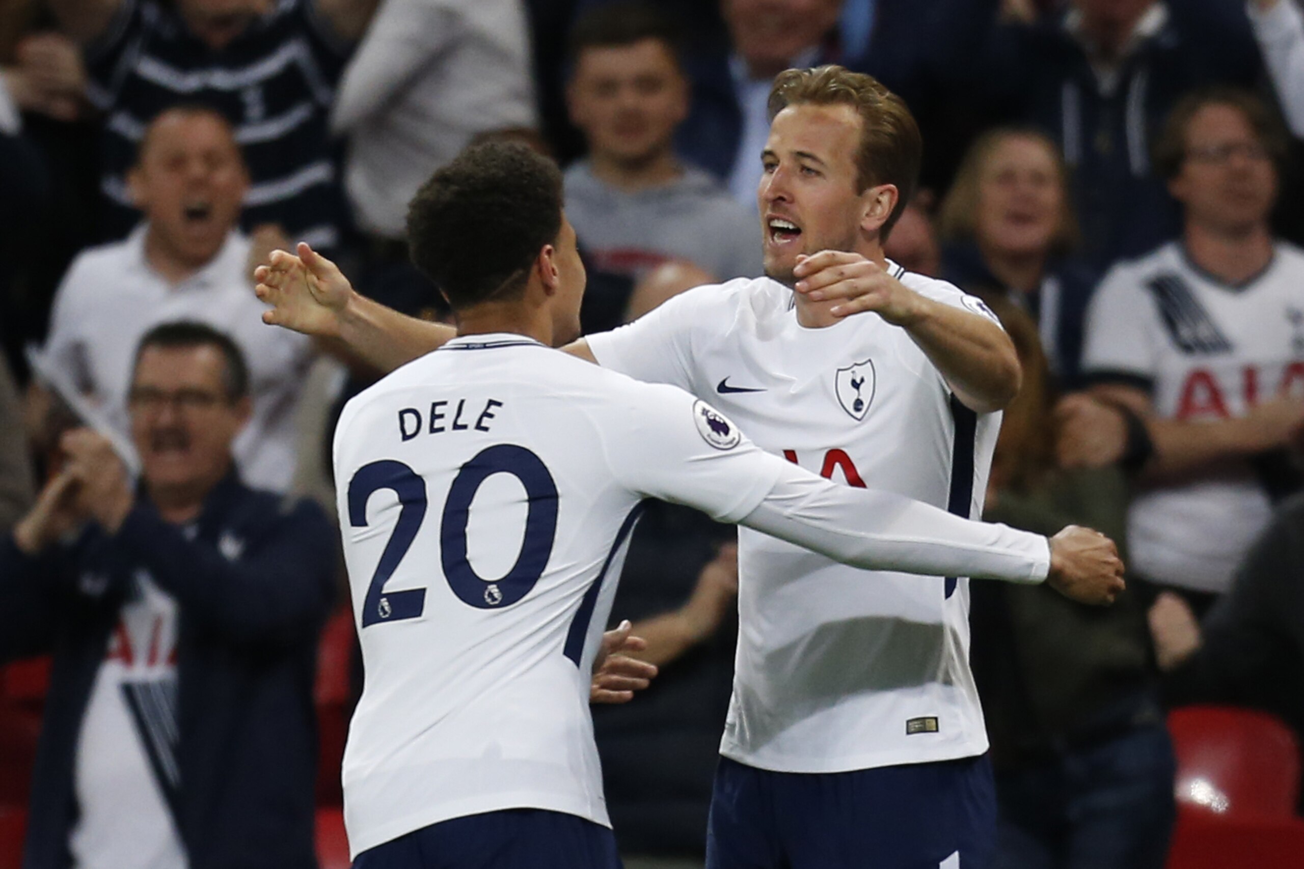 Tottenham Hotspur's English striker Harry Kane (R) celebrates after scoring with Tottenham Hotspur's English midfielder Dele Alli during the English Premier League football match between Tottenham Hotspur and Newcastle United at Wembley Stadium in London,