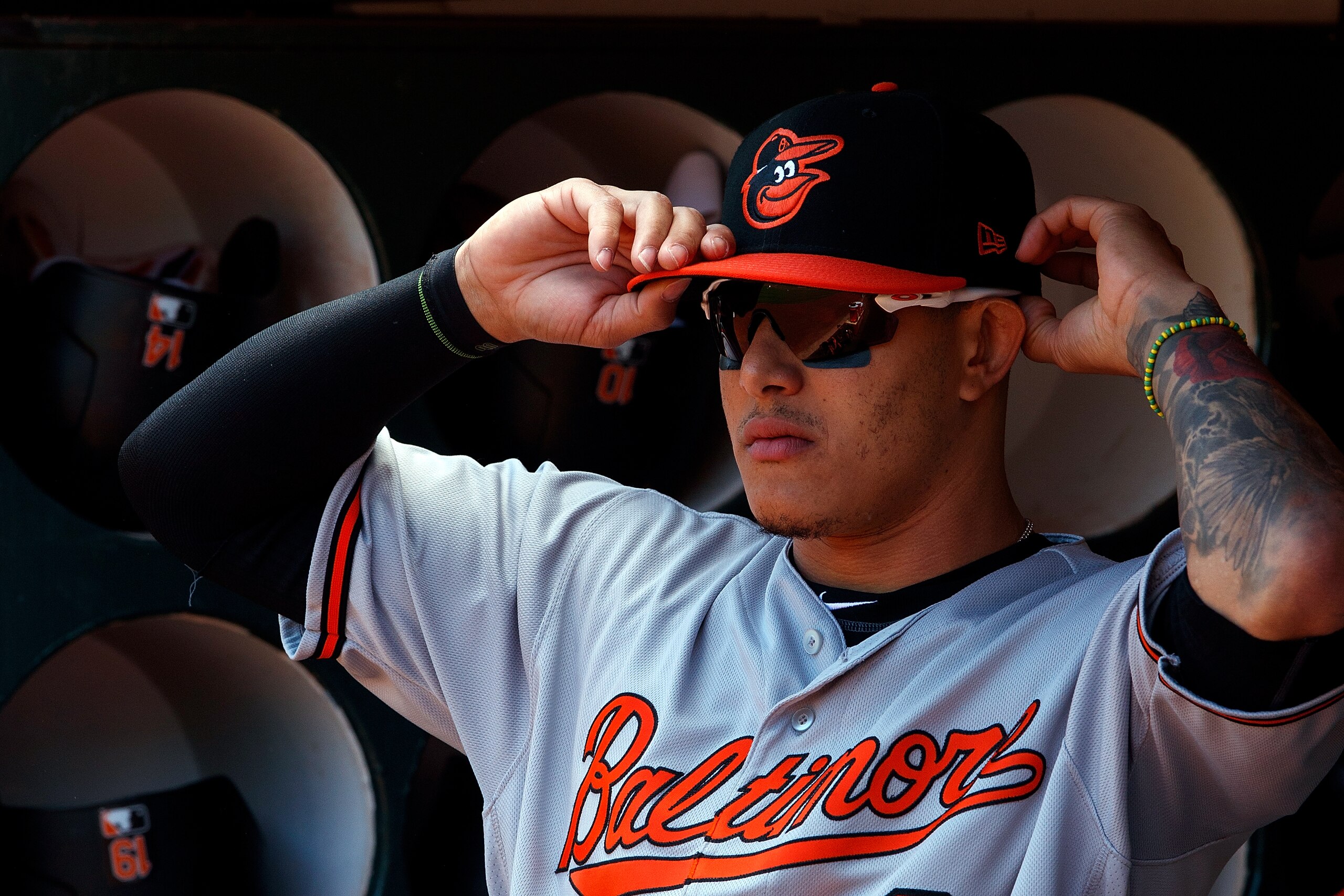 OAKLAND, CA - MAY 06:  Manny Machado #13 of the Baltimore Orioles stands in the dugout before the game against the Oakland Athletics at the Oakland Coliseum on May 6, 2018 in Oakland, California. The Oakland Athletics defeated the Baltimore Orioles 2-1. (