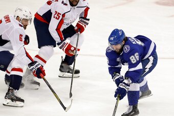 TAMPA, FL - MAY 11: Nikita Kucherov #86 of the Tampa Bay Lightning tries to get past the defense of Michal Kempny #6 and Devante Smith-Pelly #25 of the Washington Capitals during the second period in Game One of the Eastern Conference Finals during the 20