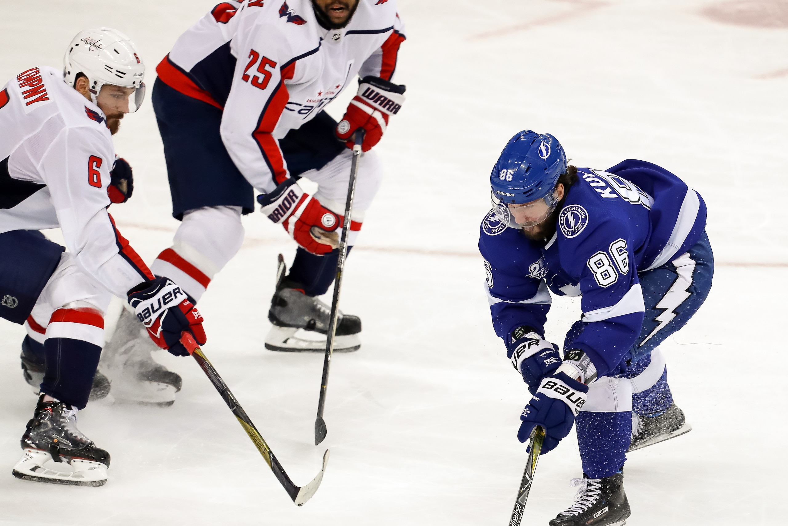 TAMPA, FL - MAY 11: Nikita Kucherov #86 of the Tampa Bay Lightning tries to get past the defense of Michal Kempny #6 and Devante Smith-Pelly #25 of the Washington Capitals during the second period in Game One of the Eastern Conference Finals during the 20