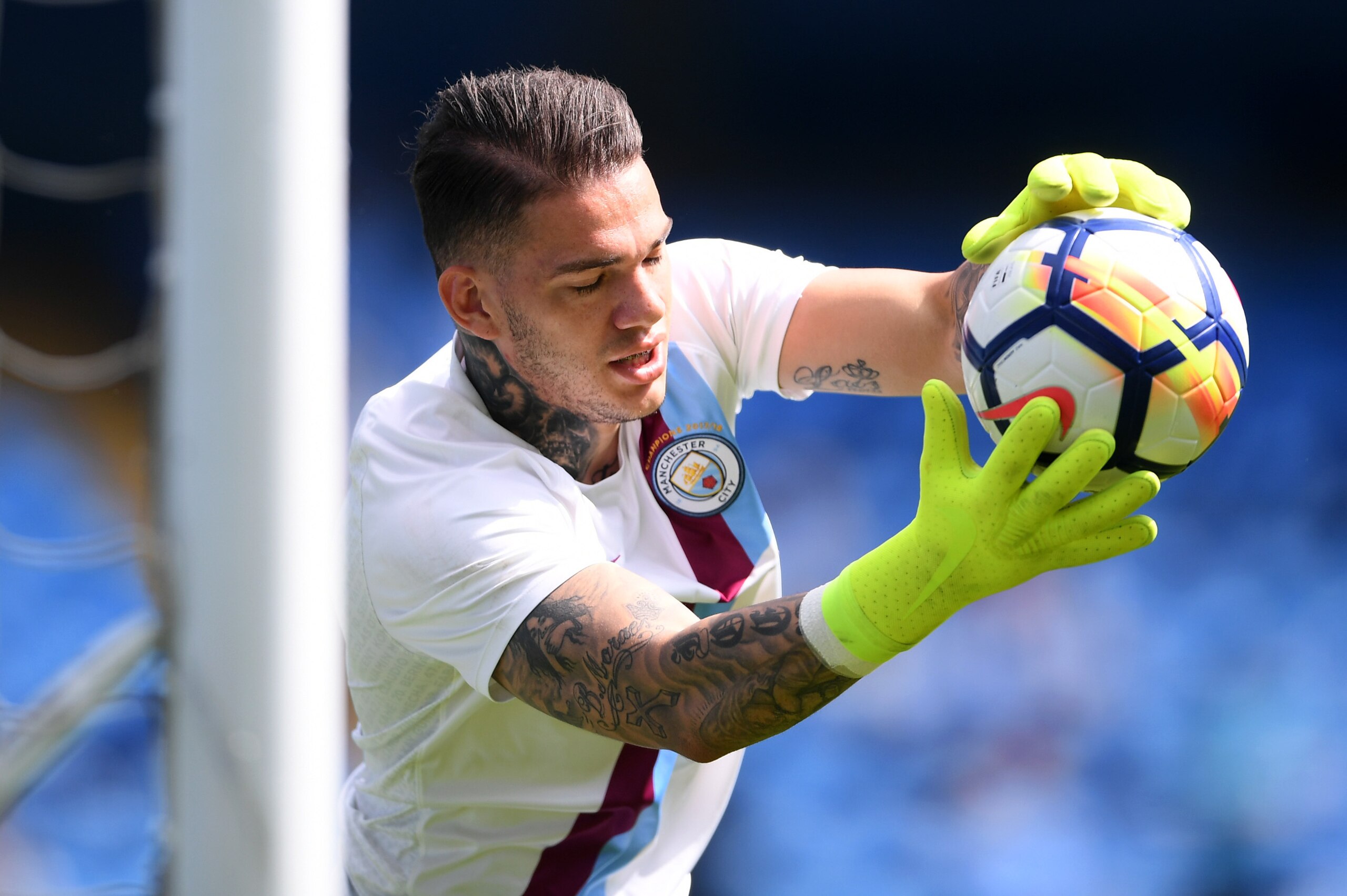MANCHESTER, ENGLAND - MAY 06:  Ederson of Manchester City warms up prior to the Premier League match between Manchester City and Huddersfield Town at Etihad Stadium on May 6, 2018 in Manchester, England.  (Photo by Laurence Griffiths/Getty Images)