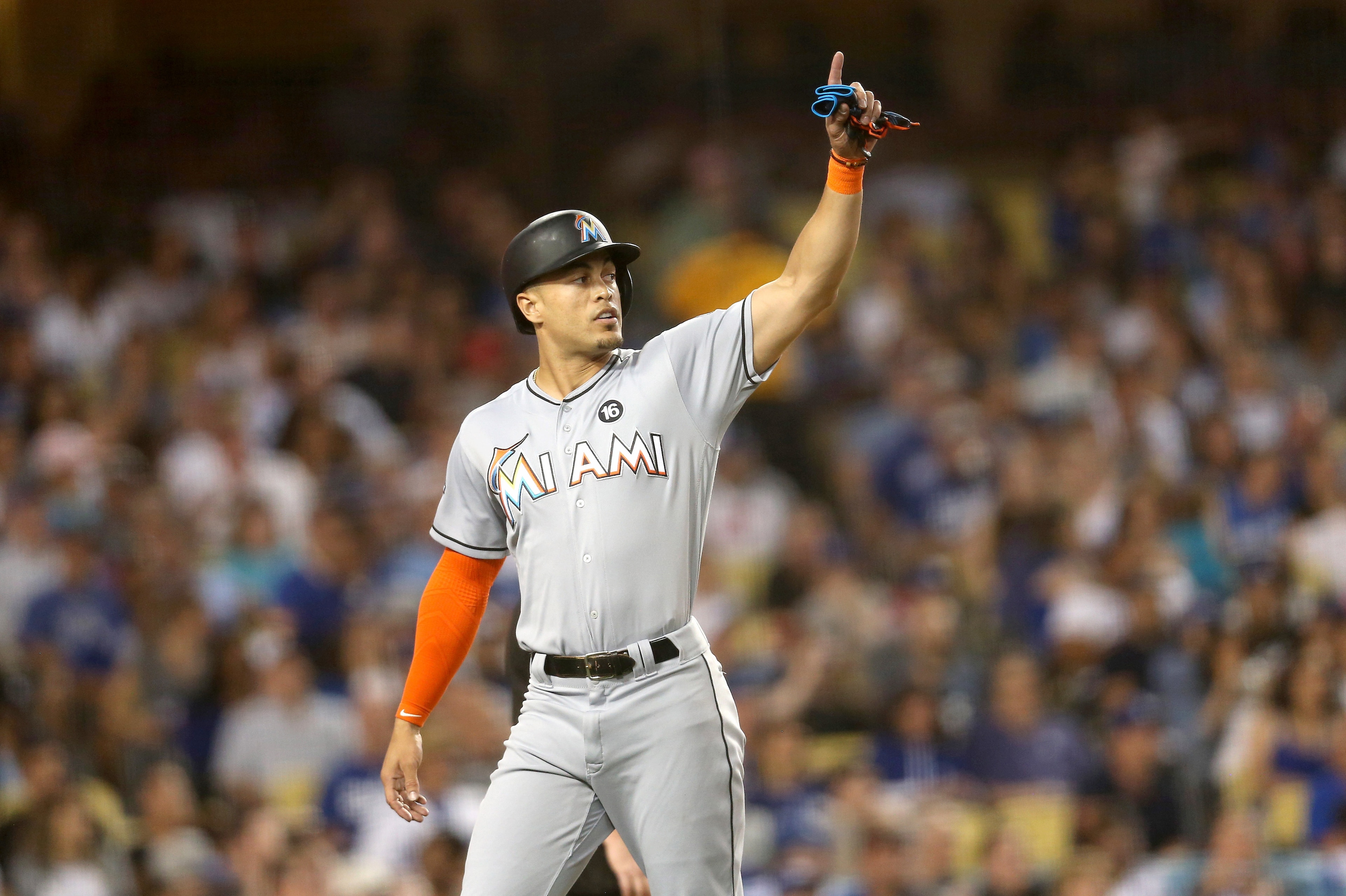 LOS ANGELES, CA - MAY 20:  Giancarlo Stanton #27 of the Miami Marlins gestures after scoring a run in the third inning against the Los Angeles Dodgers at Dodger Stadium on May 20, 2017 in Los Angeles, California.  (Photo by Stephen Dunn/Getty Images)