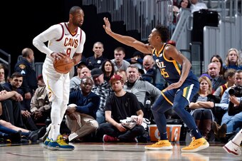 CLEVELAND, OH - DECEMBER 16: Dwyane Wade #9 of the Cleveland Cavaliers handles the ball against Donovan Mitchell #45 of the Utah Jazz during the game between the two teams  on December 16. 2017 at Quicken Loans Arena in Cleveland, Ohio. NOTE TO USER: User