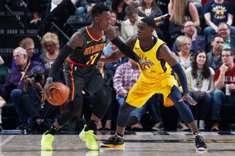 INDIANAPOLIS, IN - MARCH 09: Dennis Schroder #17 of the Atlanta Hawks handles the ball against Darren Collison #2 of the Indiana Pacers during a game at Bankers Life Fieldhouse on March 9, 2018 in Indianapolis, Indiana. The Pacers won 112-87. NOTE TO USER