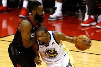 HOUSTON, TX - MAY 14: Kevin Durant #35 of the Golden State Warriors handles the ball against James Harden #13 of the Houston Rockets in the second half in Game One of the Western Conference Finals of the 2018 NBA Playoffs at Toyota Center on May 14, 2018 