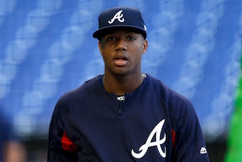 MIAMI, FL - MAY 10:  Ronald Acuna Jr. #13 of the Atlanta Braves looks on during batting practice before the game against the Miami Marlins at Marlins Park on May 10, 2018 in Miami, Florida.  (Photo by Michael Reaves/Getty Images)