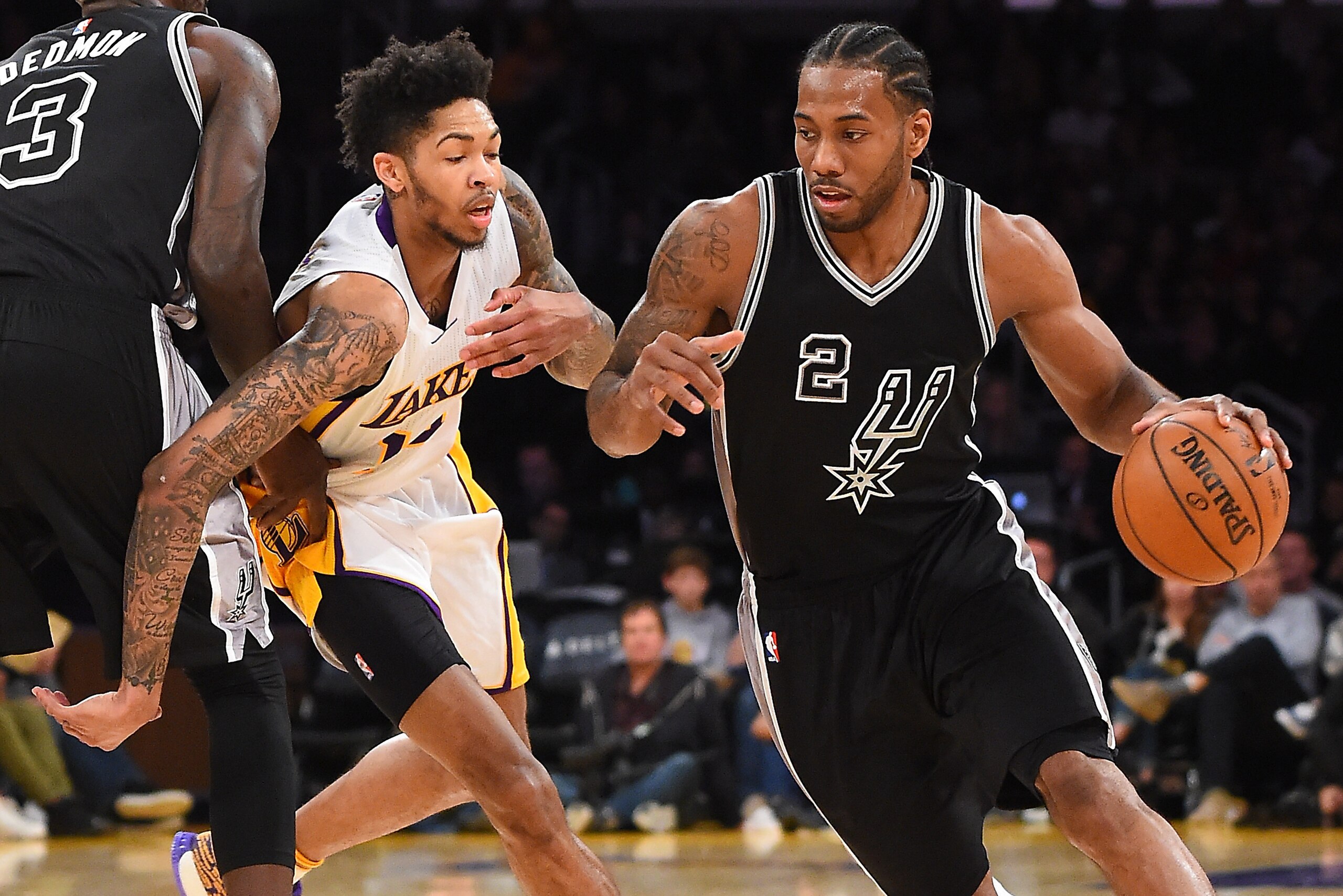 LOS ANGELES, CA - FEBRUARY 26:  Kawhi Leonard #2 of the San Antonio Spurs drives to the basket as he gets past Brandon Ingram #14 of the Los Angeles Lakers in the second half of the game at Staples Center on February 26, 2017 in Los Angeles, California. S