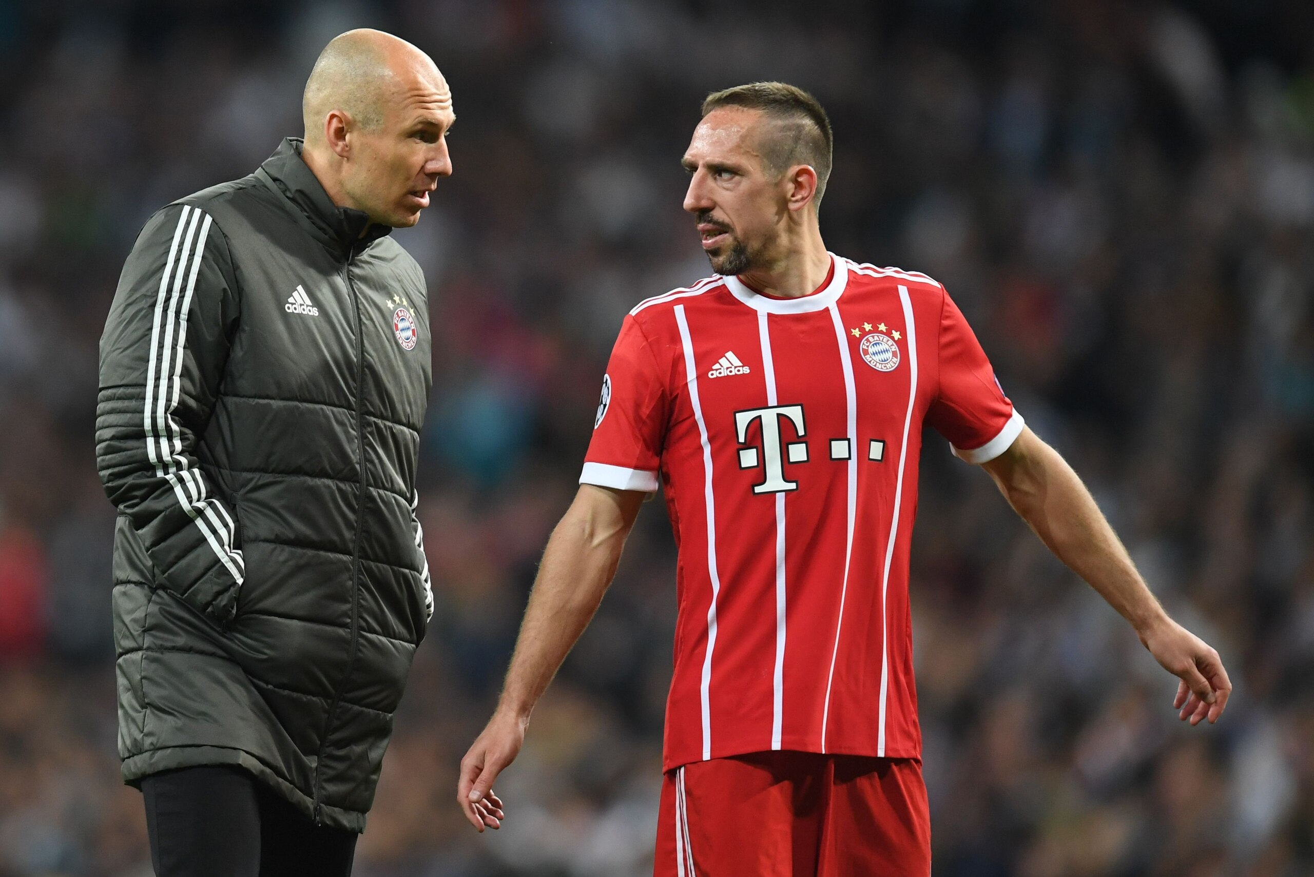 Bayern Munich's Dutch midfielder Arjen Robben (L) and Bayern Munich's French midfielder Franck Ribery react after the UEFA Champions League semi-final second-leg football match Real Madrid CF vs FC Bayern Munich in Madrid, Spain, on May 1, 2018. (Photo by