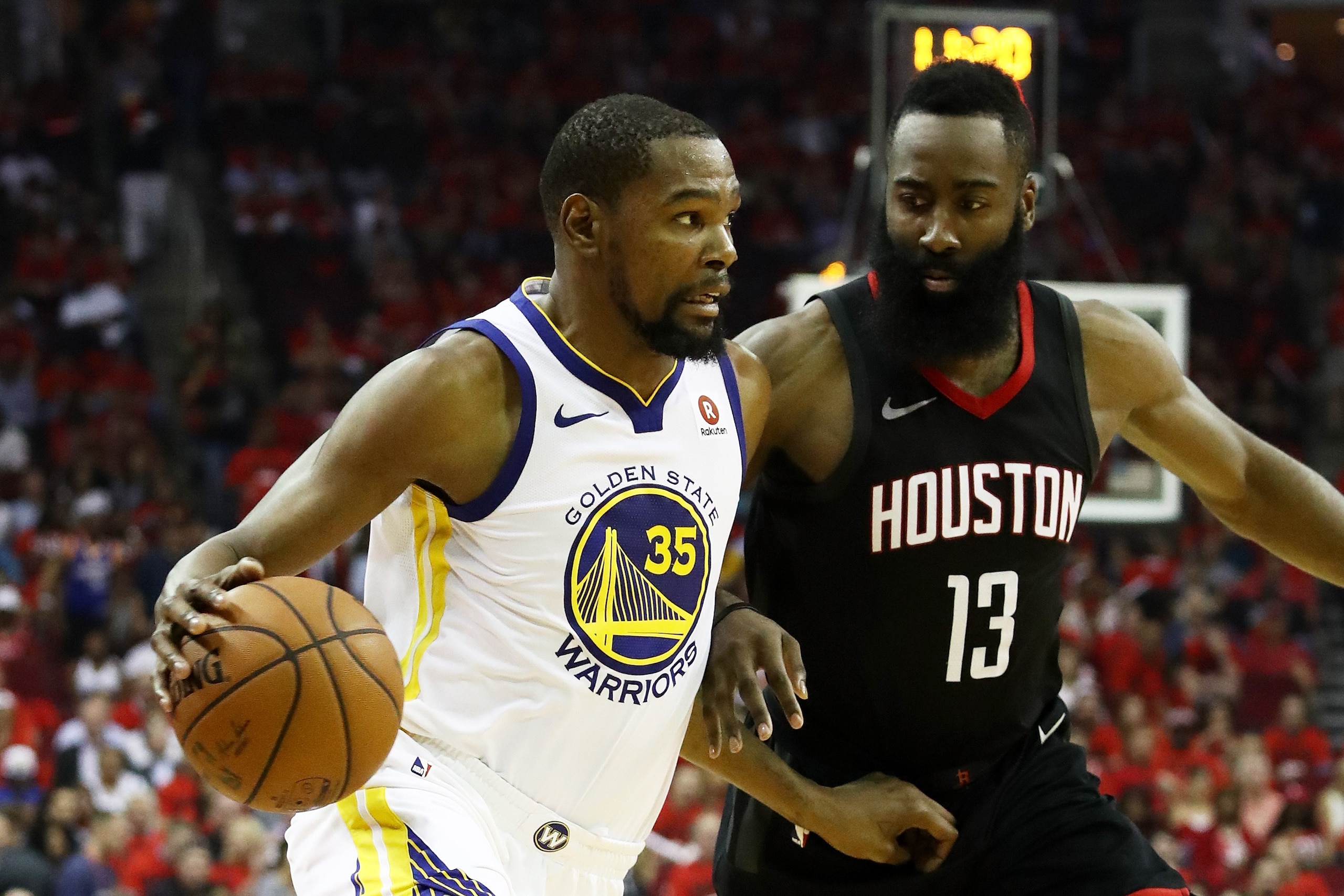 HOUSTON, TX - MAY 16:  Kevin Durant #35 of the Golden State Warriors drives against James Harden #13 of the Houston Rockets in the third quarter of Game Two of the Western Conference Finals of the 2018 NBA Playoffs at Toyota Center on May 16, 2018 in Hous