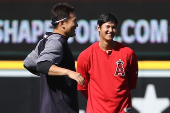 ANAHEIM, CA - APRIL 27: Japanese pitchers Masahiro Tanaka #19 of the New York Yankees and Shohei Ohtani #17 of the Los Angeles Angels of Anaheim share a laugh in the outfield before batting practice of their MLB game at Angel Stadium on April 27, 2018 in 