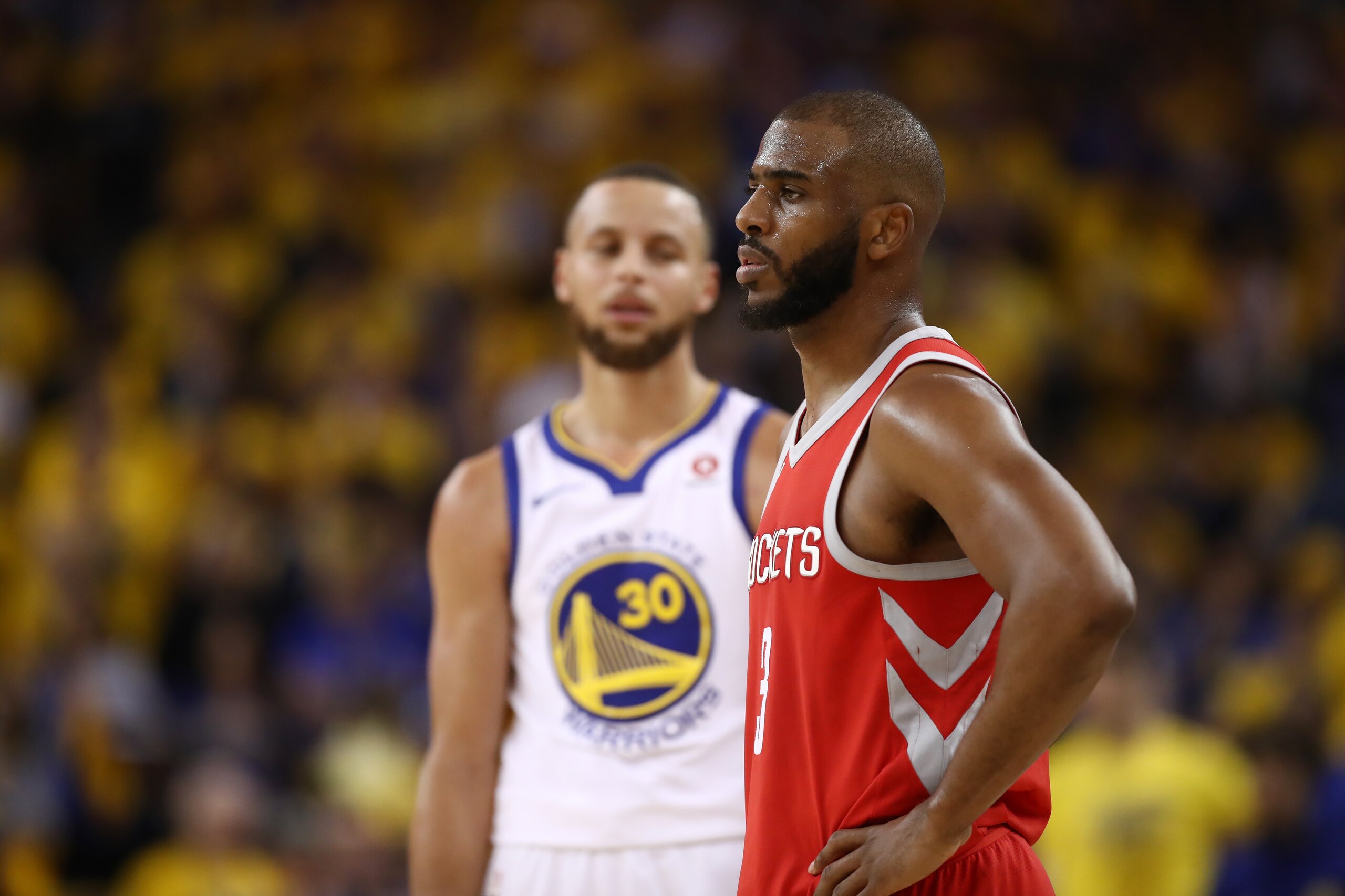 OAKLAND, CA - MAY 20:  Stephen Curry #30 of the Golden State Warriors and Chris Paul #3 of the Houston Rockets stand on the court during Game Three of the Western Conference Finals of the 2018 NBA Playoffs at ORACLE Arena on May 20, 2018 in Oakland, Calif