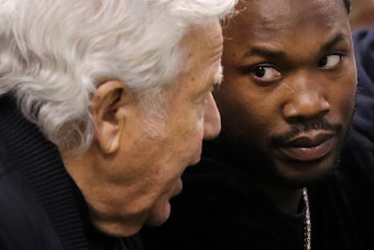 BOSTON, MA - MAY 3: Rapper Meek Mill talks with New England Patriots owner Robert Kraft during Game Two of the Eastern Conference Second Round of the  2018 NBA Playoffs between the Boston Celtics and the Philadelphia 76ers at TD Garden on May 3, 2018 in B