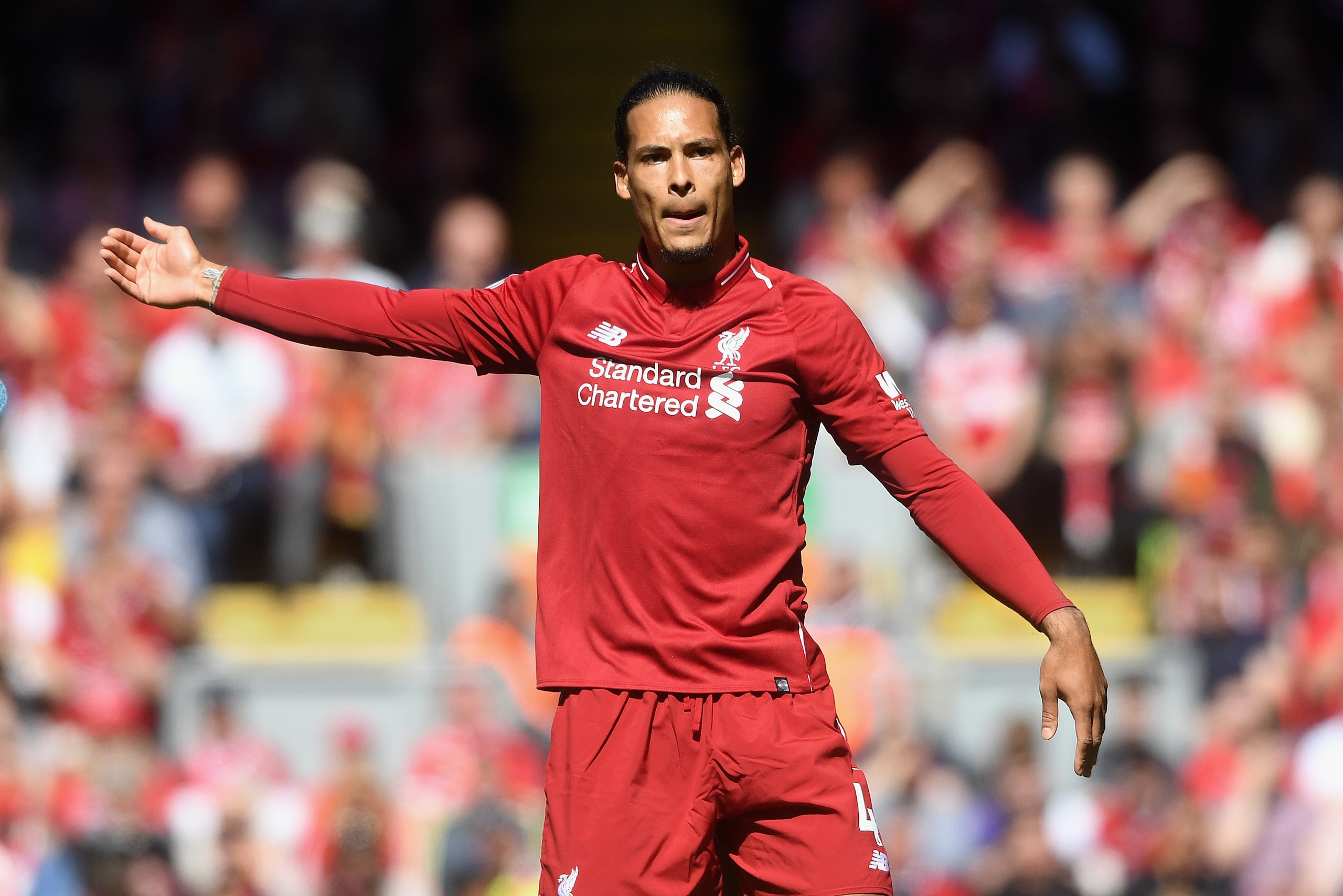 LIVERPOOL, ENGLAND - MAY 13:  Virgil van Dijk  of Liverpool in action during the Premier League match between Liverpool and Brighton and Hove Albion at Anfield on May 13, 2018 in Liverpool, England.  (Photo by Michael Regan/Getty Images)
