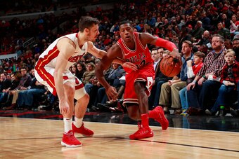 CHICAGO, IL - JANUARY 15:  Kris Dunn #32 of the Chicago Bulls dribbles the ball while guarded by Goran Dragic #7 of the Miami Heat on January 15, 2018 at the United Center in Chicago, Illinois. NOTE TO USER: User expressly acknowledges and agrees that, by