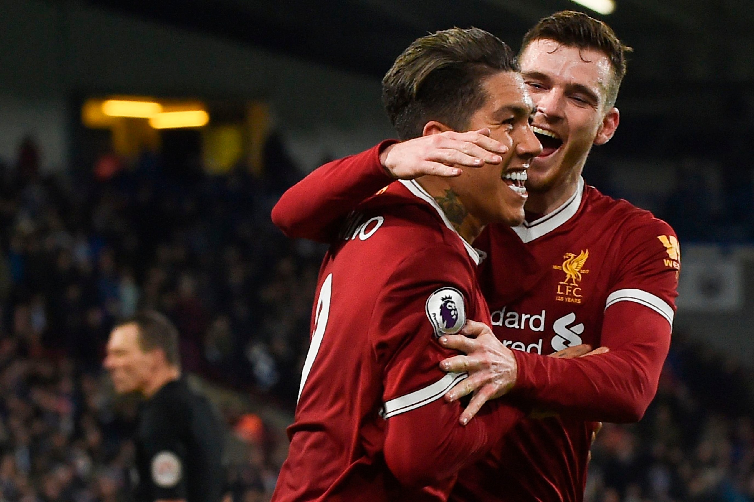 Liverpool's Brazilian midfielder Roberto Firmino (L) celebrates scoring their second goal with Liverpool's Scottish defender Andrew Robertson (R) during the English Premier League football match between Huddersfield Town and Liverpool at the John Smith's Liverpool's Brazilian midfielder Roberto Firmino (L) celebrates scoring their second goal with Liverpool's Scottish defender Andrew Robertson (R) during the English Premier League football match between Huddersfield Town and Liverpool at the John Smith's