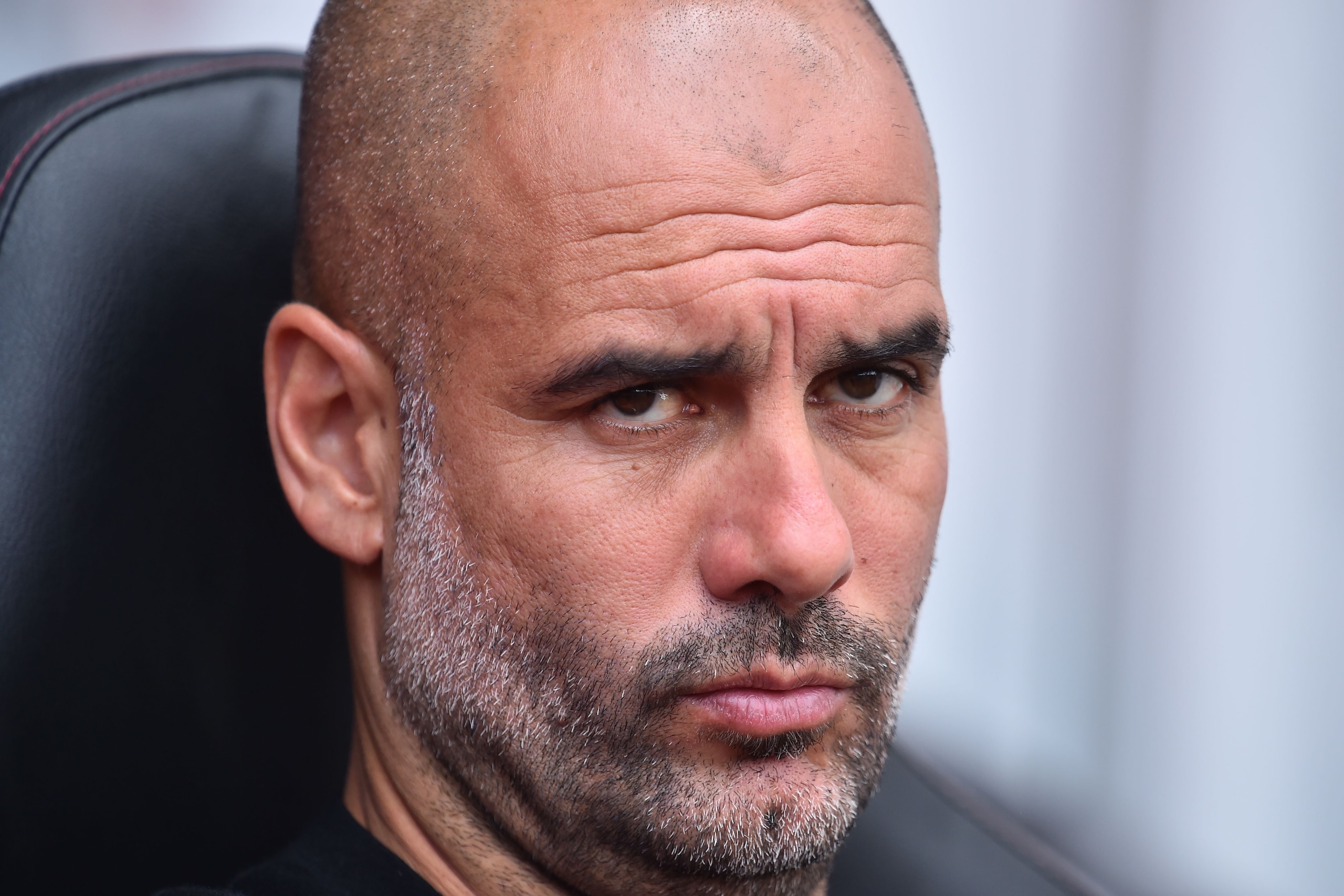 Manchester City's Spanish manager Pep Guardiola gestures in his seat ahead of the English Premier League football match between Southampton and Manchester City at St Mary's Stadium in Southampton, southern England on May 13, 2018. (Photo by Glyn KIRK / AF