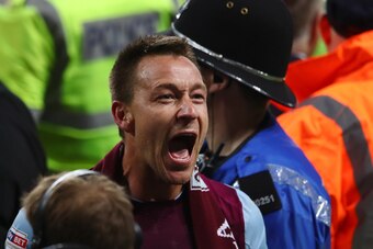 BIRMINGHAM, ENGLAND - MAY 15:  John Terry of Aston Villa celebrates at the full time whistle during the pitch invasion during the Sky Bet Championship Play Off Semi Final second leg match between Aston Villa and Middlesbrough at Villa Park on May 15, 2018