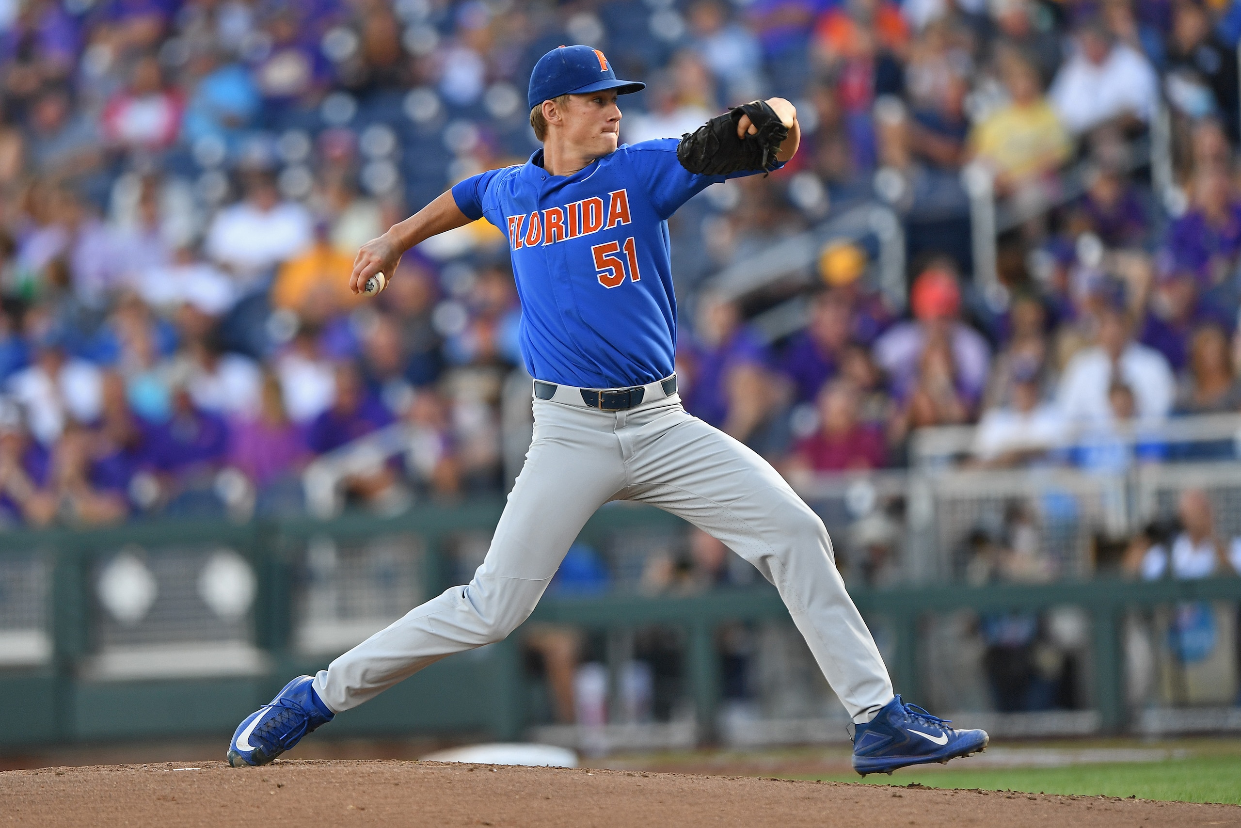 Omaha, NE - JUNE 26:  Pitcher Brady Singer #51 of the Florida Gators delivers a pitch against the LSU Tigers in the first inning during game one of the College World Series Championship Series on June 26, 2017 at TD Ameritrade Park in Omaha, Nebraska.  (P