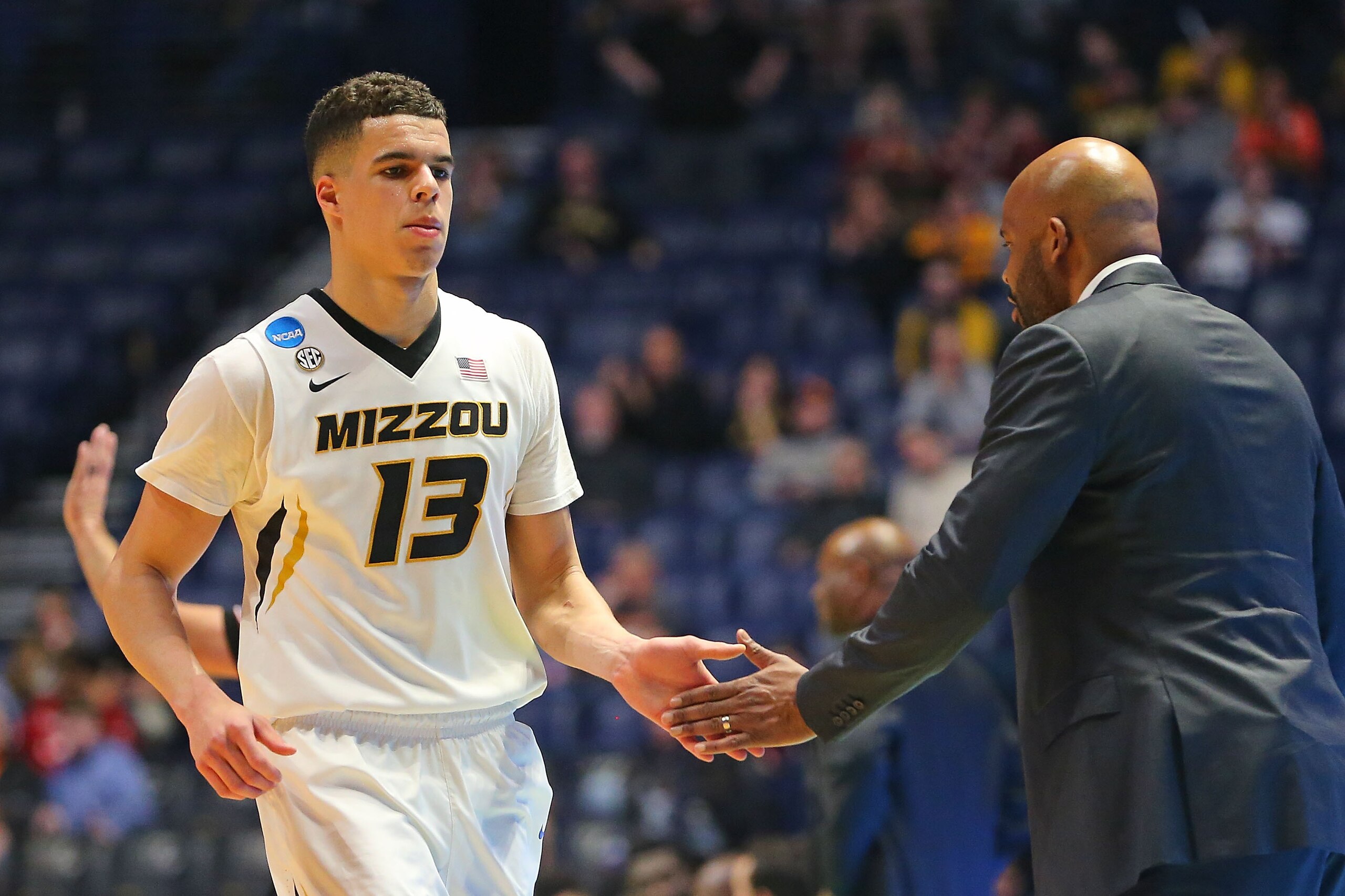 NASHVILLE, TN - MARCH 16:  Michael Porter Jr. #13 of the Missouri Tigers high fives head coach Cuonzo Martin as he comes off the court during a game against the Florida State Seminoles during the first round of the 2018 NCAA Men's Basketball Tournament at