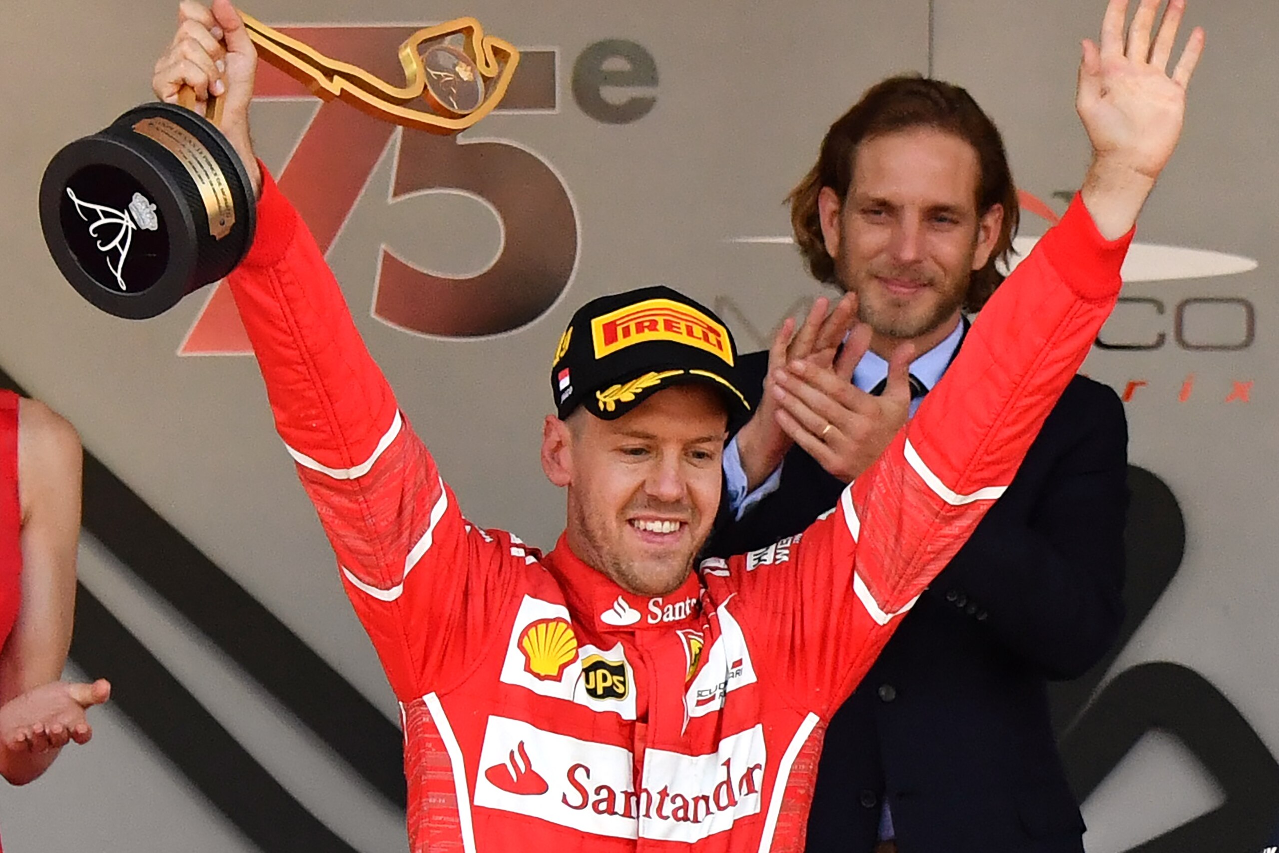 Ferrari's German driver Sebastian Vettel holds his trophy as he celebrates on the podium after winning the Monaco Formula 1 Grand Prix at the Monaco street circuit, on May 28, 2017 in Monaco. / AFP PHOTO / PASCAL GUYOT        (Photo credit should read PAS