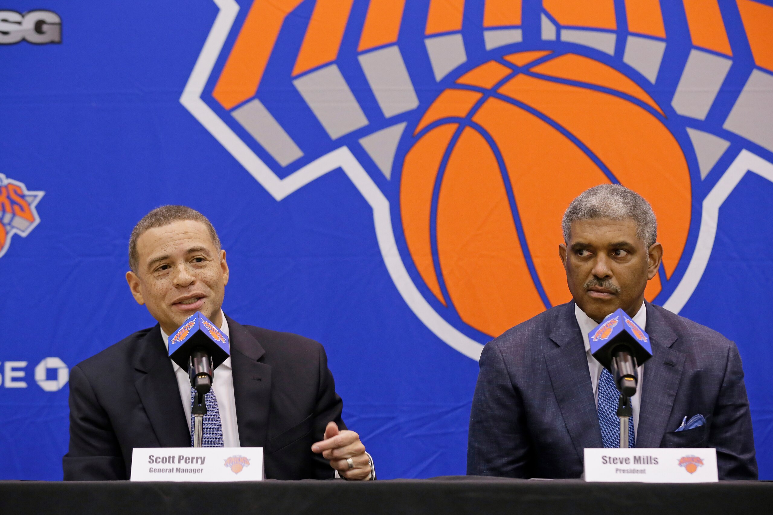 GREENBURG, NY - JULY 17:  New York Knicks team President, Steve Mills and Jeff Hornacek of the New York Knicks introduce General Manager Scott Perry at a pess conference at the at Knicks Practice Center July 17, 2017 in Greenburg, New York. NOTE TO USER: