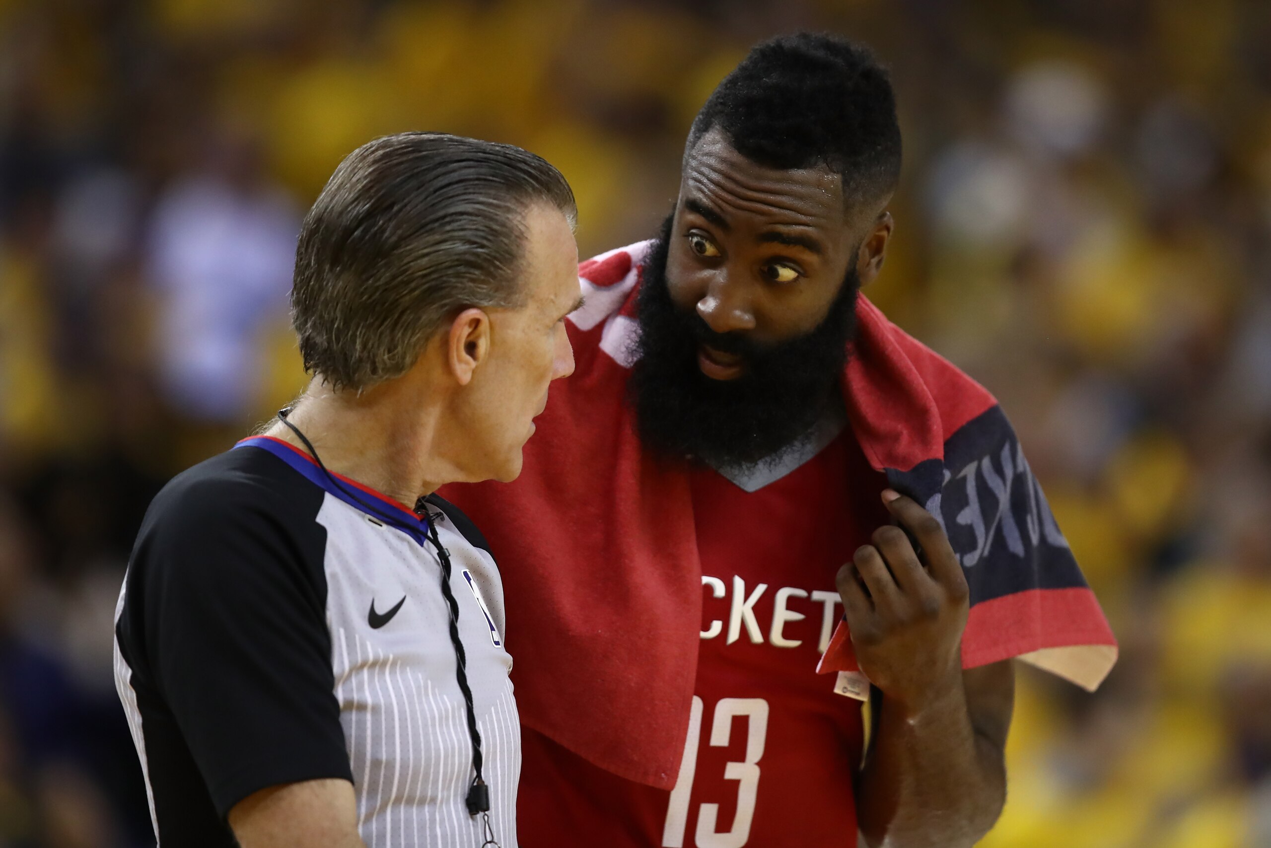 OAKLAND, CA - MAY 26:  James Harden #13 of the Houston Rockets speaks with referee Ken Mauer #41 during Game Six of the Western Conference Finals in the 2018 NBA Playoffs against the Golden State Warriors at ORACLE Arena on May 26, 2018 in Oakland, Califo