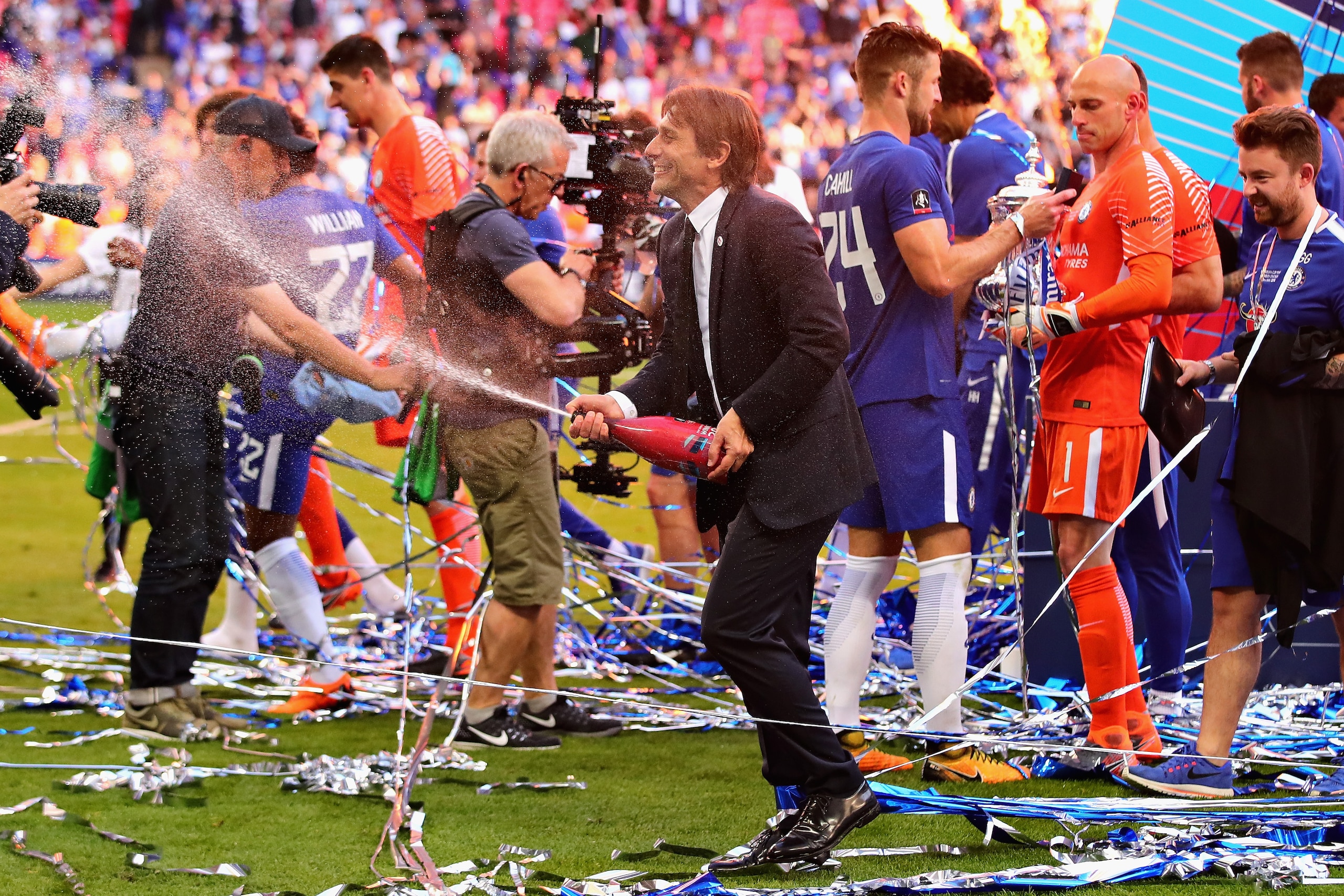 LONDON, ENGLAND - MAY 19: Manager of Chelsea, Antonio Conte celebrates with champagne after the Emirates FA Cup Final between Chelsea and Manchester United at Wembley Stadium on May 19, 2018 in London, England. (Photo by Chris Brunskill Ltd/Getty Images LONDON, ENGLAND - MAY 19: Manager of Chelsea, Antonio Conte celebrates with champagne after the Emirates FA Cup Final between Chelsea and Manchester United at Wembley Stadium on May 19, 2018 in London, England. (Photo by Chris Brunskill Ltd/Getty Images