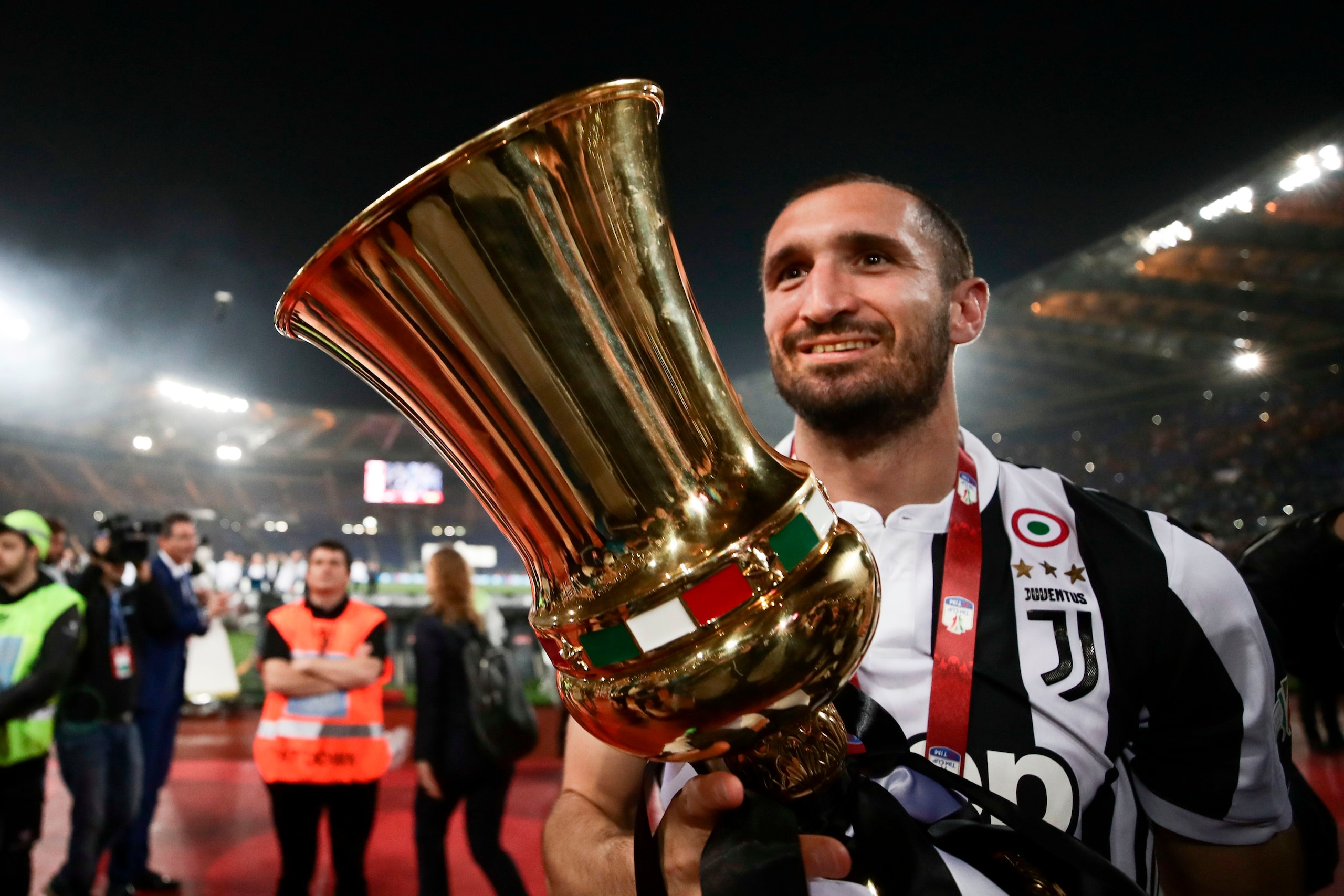 Juventus' defender from Italy Giorgio Chiellini celebrates with the trophy at the end of the Italian Tim Cup (Coppa Italia) final Juventus vs AC Milan at the Olympic stadium on May 9, 2018 in Rome. - Juventus crushed AC Milan 4-0 on today at the Stadio Ol Juventus' defender from Italy Giorgio Chiellini celebrates with the trophy at the end of the Italian Tim Cup (Coppa Italia) final Juventus vs AC Milan at the Olympic stadium on May 9, 2018 in Rome. - Juventus crushed AC Milan 4-0 on today at the Stadio Ol