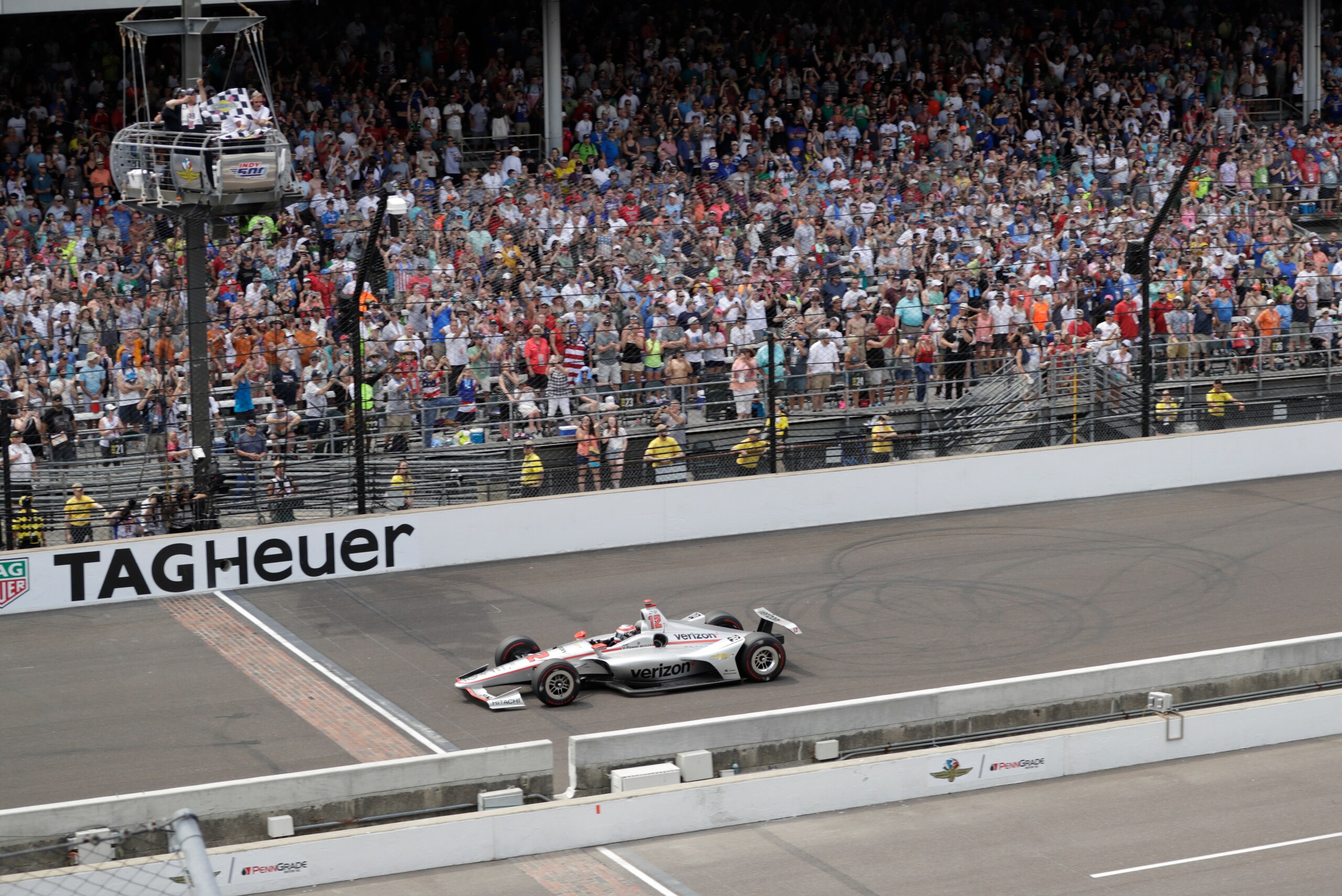 Power gets the checkered flag as he approaches the finish line. Power gets the checkered flag as he approaches the finish line.