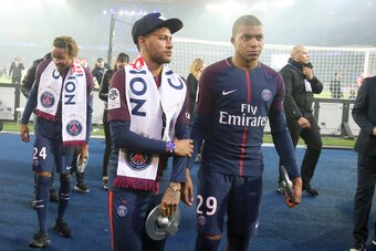 PARIS, FRANCE - MAY 12: Neymar Jr, Kylian Mbappe of PSG celebrate during the French Ligue 1 Championship Trophy Ceremony following the Ligue 1 match between Paris Saint-Germain (PSG) and Stade Rennais (Rennes) at Parc des Princes stadium on May 12, 2018 i