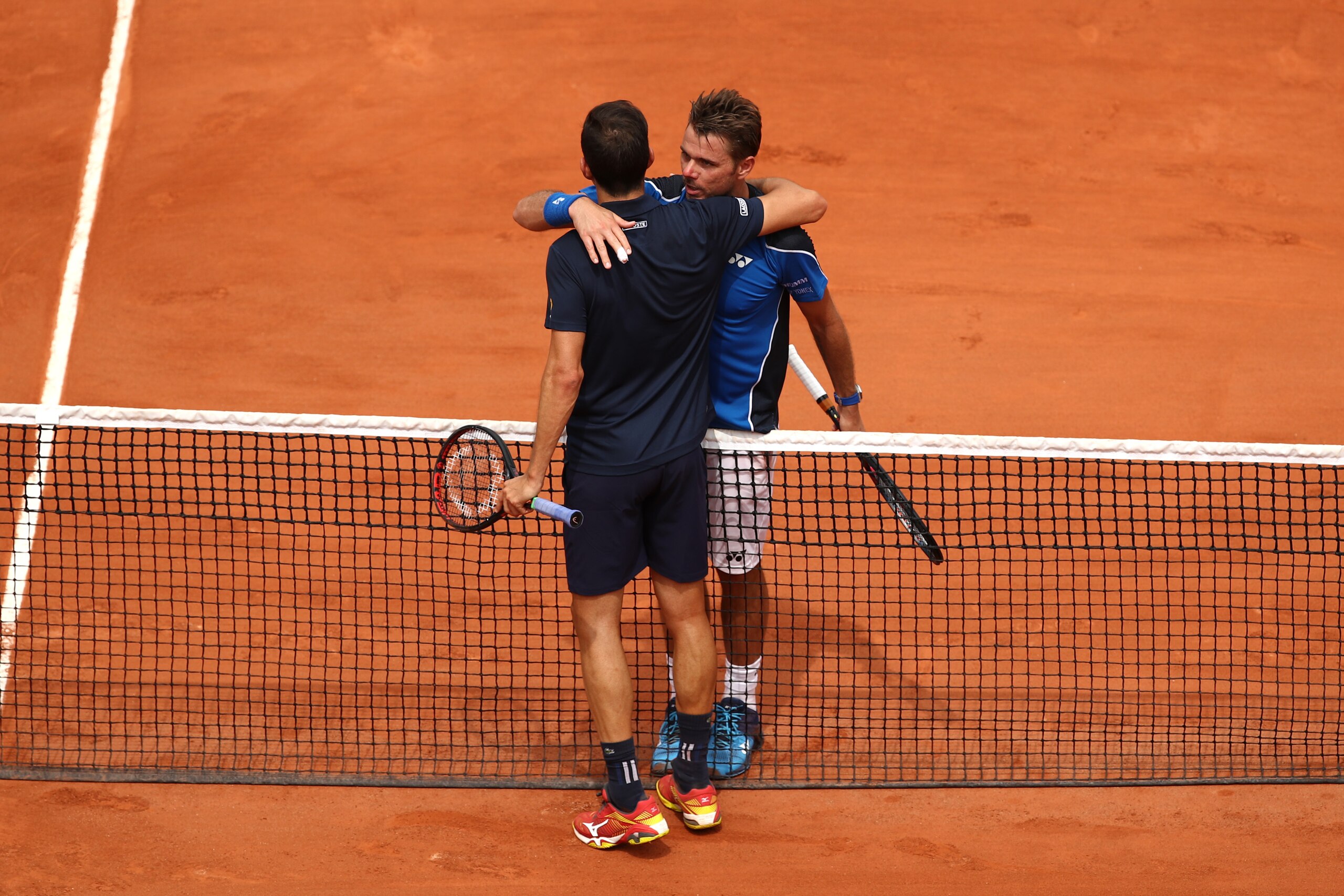 PARIS, FRANCE - MAY 28:  Stan Wawrinka of Switzerland congratulates Guillermo Garcia-Lopez of Spain on victory following during day two of the 2018 French Open at Roland Garros on May 28, 2018 in Paris, France.  (Photo by Cameron Spencer/Getty Images)