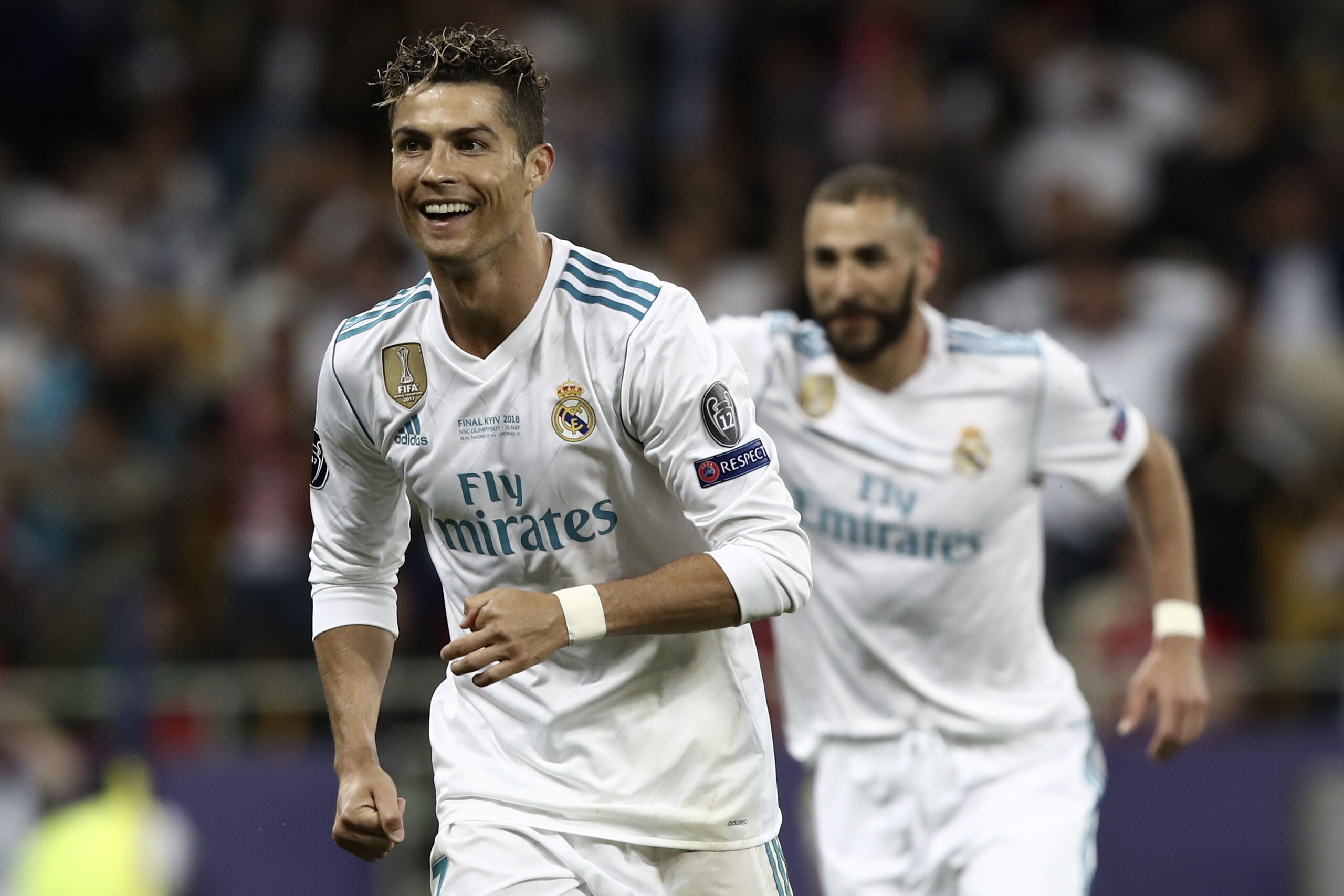 Real Madrid's Portuguese forward Cristiano Ronaldo (L) cele brates after Real Madrid's Welsh forward Gareth Bale scored a goal during the UEFA Champions League final football match between Liverpool and Real Madrid at the Olympic Stadium in Kiev, Ukraine 