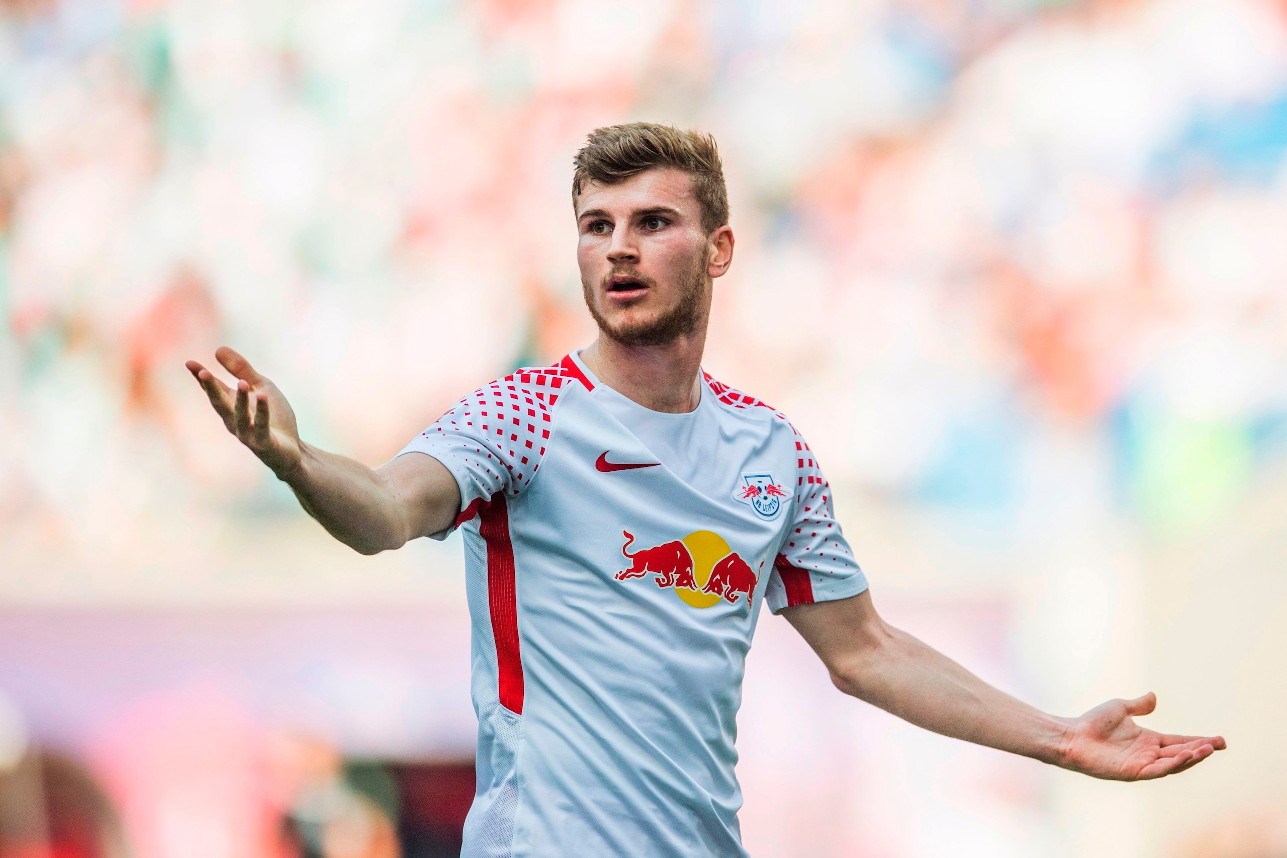 Leipzig's German forward Timo Werner gestures during the German first division Bundesliga football match between RB Leipzig and TSG Hoffenheim in Leipzig, eastern Germany on April 21, 2018. (Photo by ROBERT MICHAEL / AFP) / RESTRICTIONS: DURING MATCH TIME