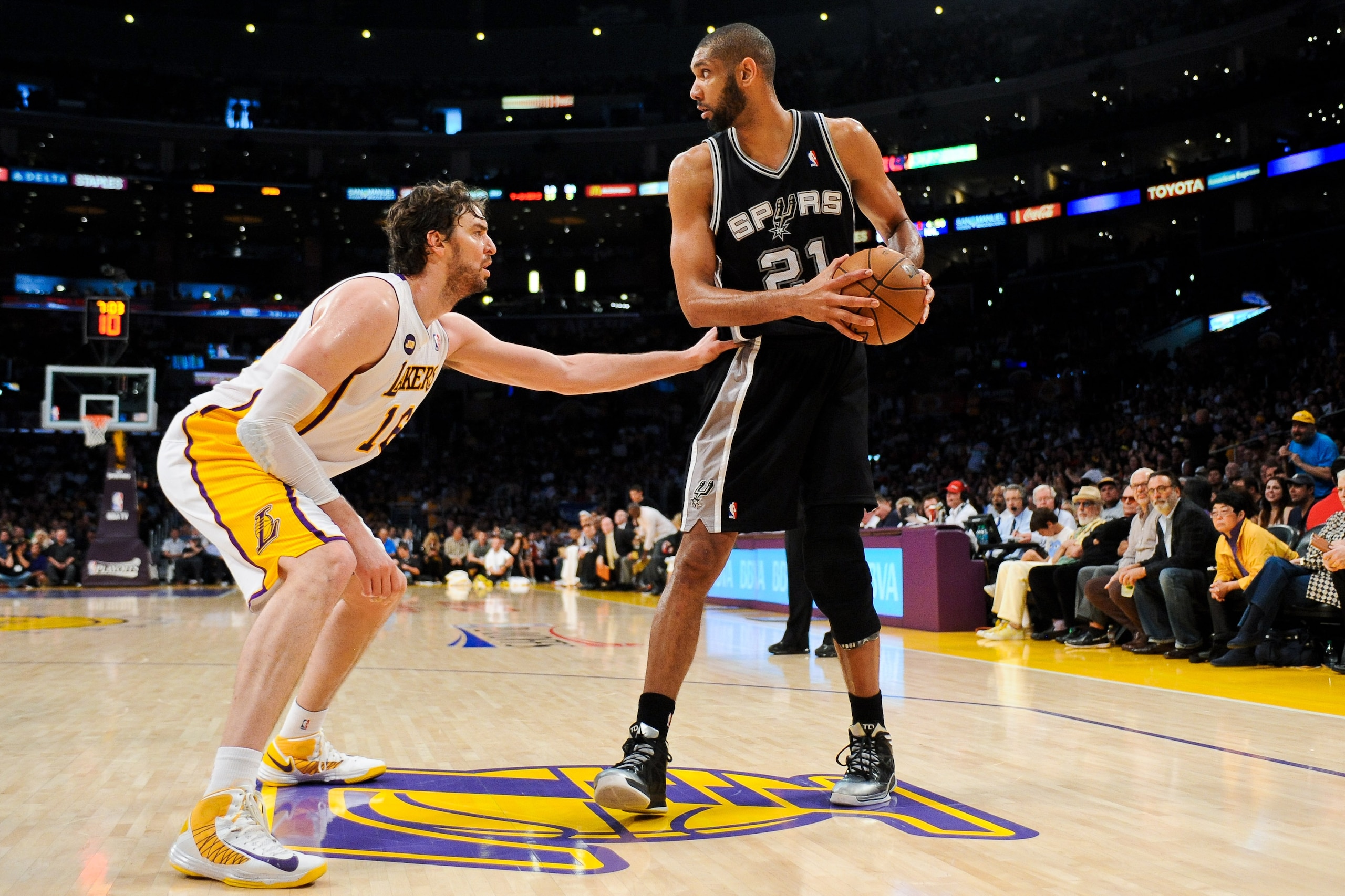LOS ANGELES, CA - APRIL 28: Tim Duncan #21 of the San Antonio Spurs controls the ball against Pau Gasol #16 of the Los Angeles Lakers in Game Four of the Western Conference Quarterfinals during the 2013 NBA Playoffs at Staples Center on April 28, 2013 in LOS ANGELES, CA - APRIL 28: Tim Duncan #21 of the San Antonio Spurs controls the ball against Pau Gasol #16 of the Los Angeles Lakers in Game Four of the Western Conference Quarterfinals during the 2013 NBA Playoffs at Staples Center on April 28, 2013 in