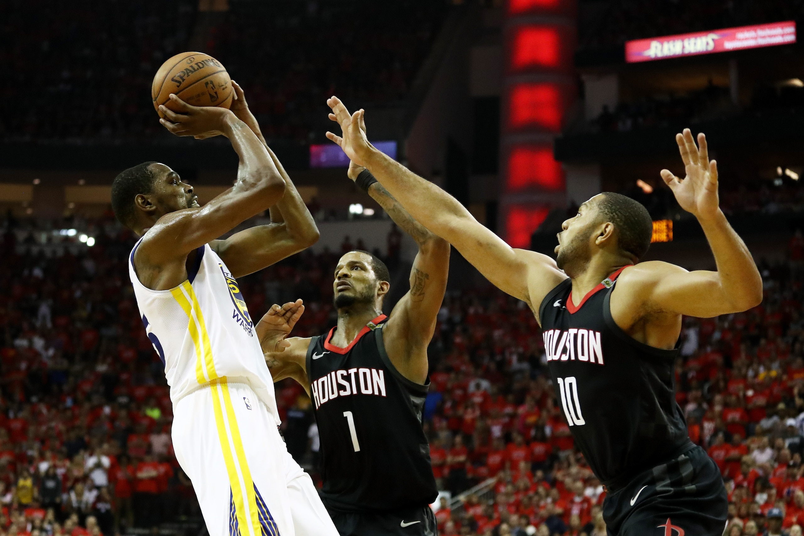 HOUSTON, TX - MAY 28: Kevin Durant #35 of the Golden State Warriors shoots against Trevor Ariza #1 and Eric Gordon #10 of the Houston Rockets in the third quarter of Game Seven of the Western Conference Finals of the 2018 NBA Playoffs at Toyota Center on HOUSTON, TX - MAY 28: Kevin Durant #35 of the Golden State Warriors shoots against Trevor Ariza #1 and Eric Gordon #10 of the Houston Rockets in the third quarter of Game Seven of the Western Conference Finals of the 2018 NBA Playoffs at Toyota Center on