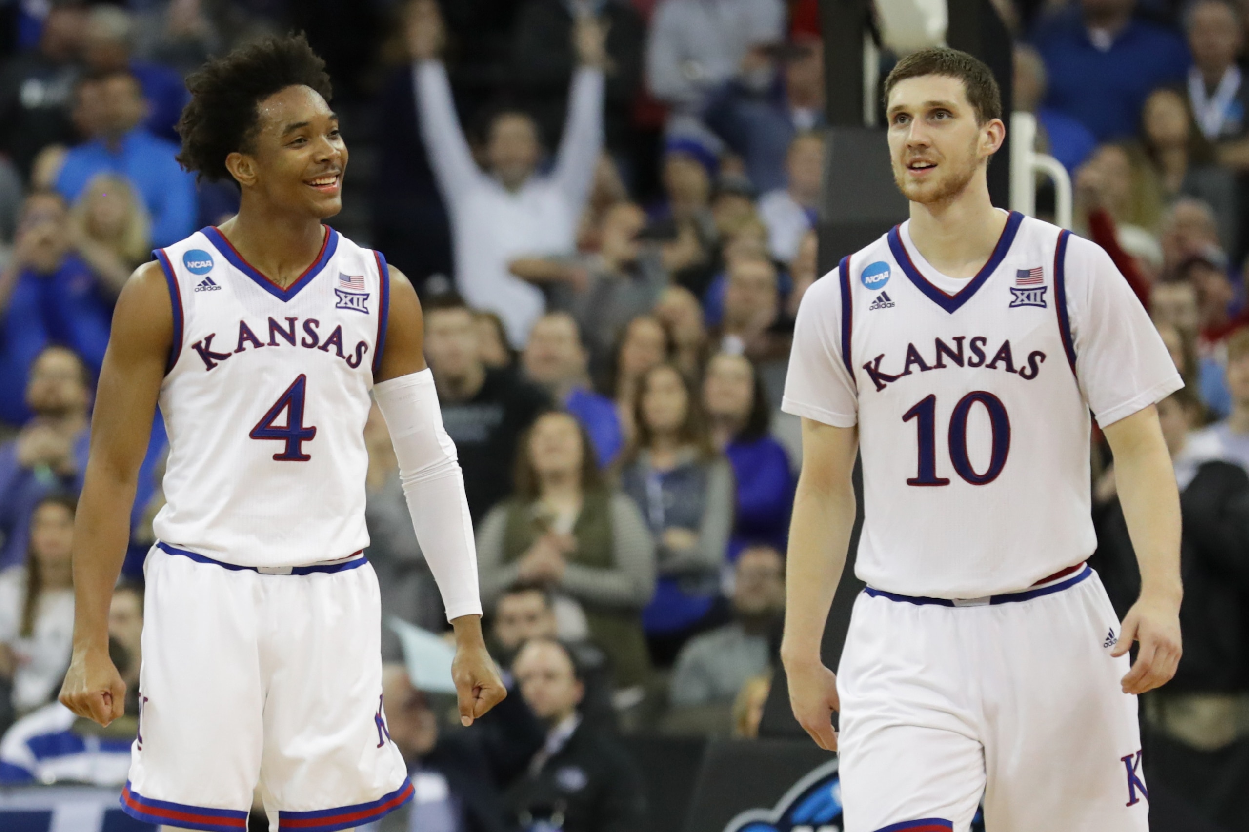 OMAHA, NE - MARCH 25: Devonte' Graham #4 and Sviatoslav Mykhailiuk #10 of the Kansas Jayhawks celebrate as they defeat the Duke Blue Devils in the 2018 NCAA Men's Basketball Tournament Midwest Regional at CenturyLink Center on March 25, 2018 in Omaha, Neb