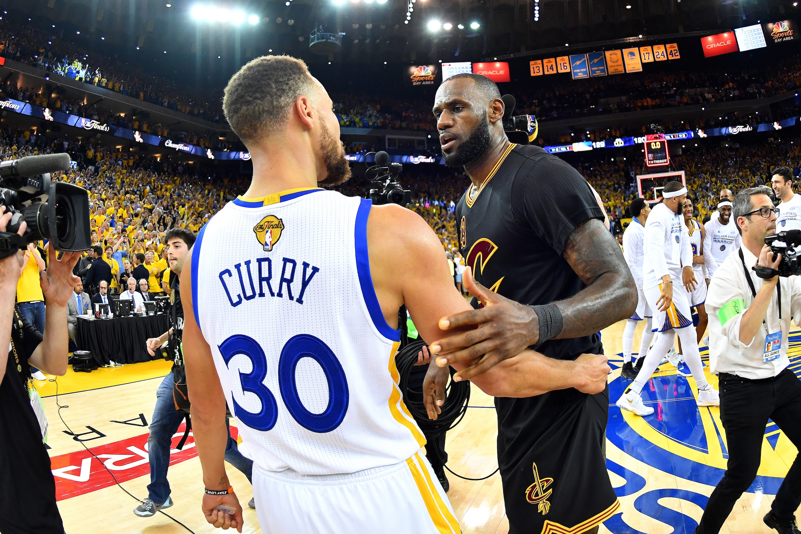 OAKLAND, CA - JUNE 12: LeBron James #23 of the Cleveland Cavaliers talks with Stephen Curry #30 of the Golden State Warriors in Game Five of the 2017 NBA Finals on June 12, 2017 at ORACLE Arena in Oakland, California. NOTE TO USER: User expressly acknowle OAKLAND, CA - JUNE 12: LeBron James #23 of the Cleveland Cavaliers talks with Stephen Curry #30 of the Golden State Warriors in Game Five of the 2017 NBA Finals on June 12, 2017 at ORACLE Arena in Oakland, California. NOTE TO USER: User expressly acknowle