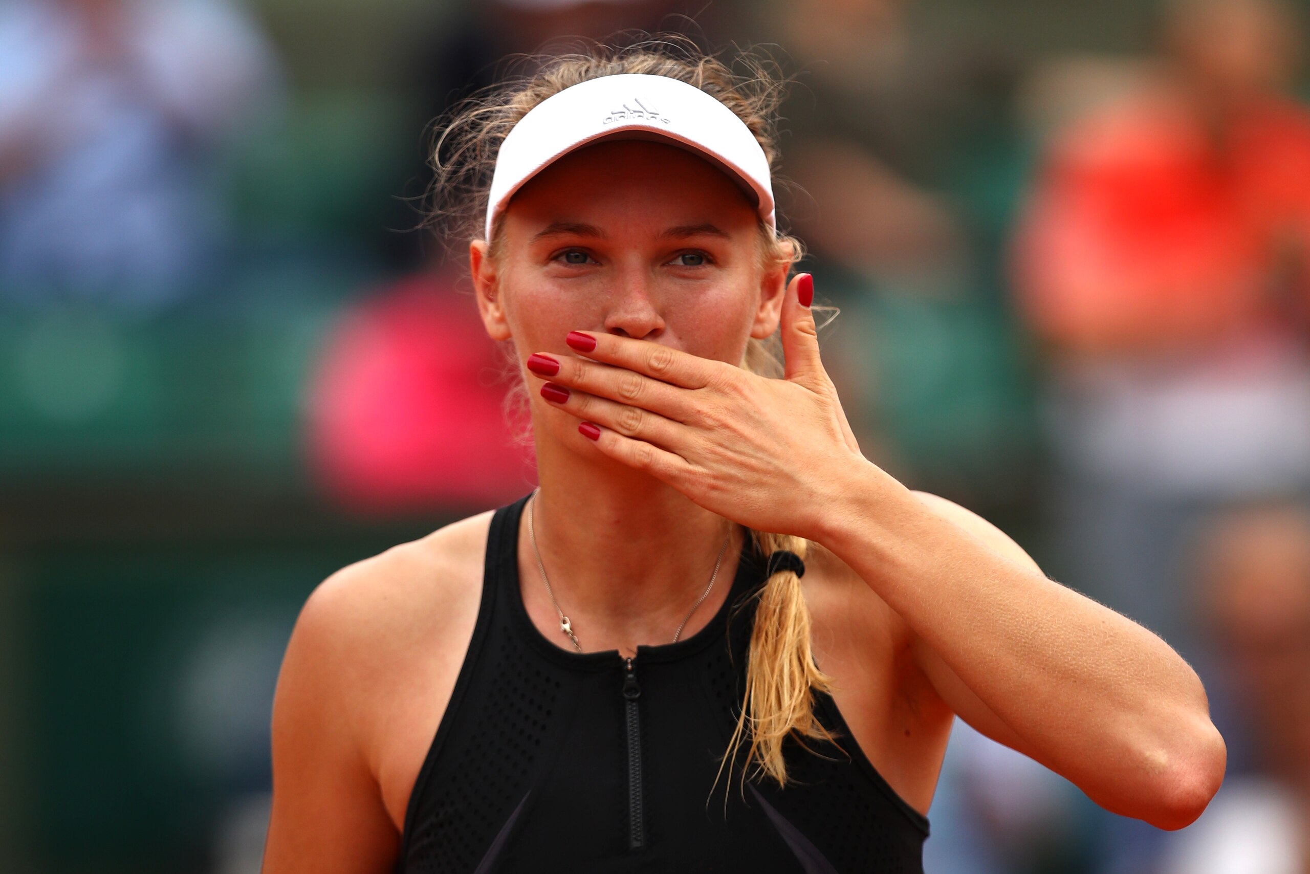 PARIS, FRANCE - MAY 28:  Caroline Wozniacki of Denmark celebrates victory following the ladies singles first round match against Danielle Collins of The United States during day two of the 2018 French Open at Roland Garros on May 28, 2018 in Paris, France